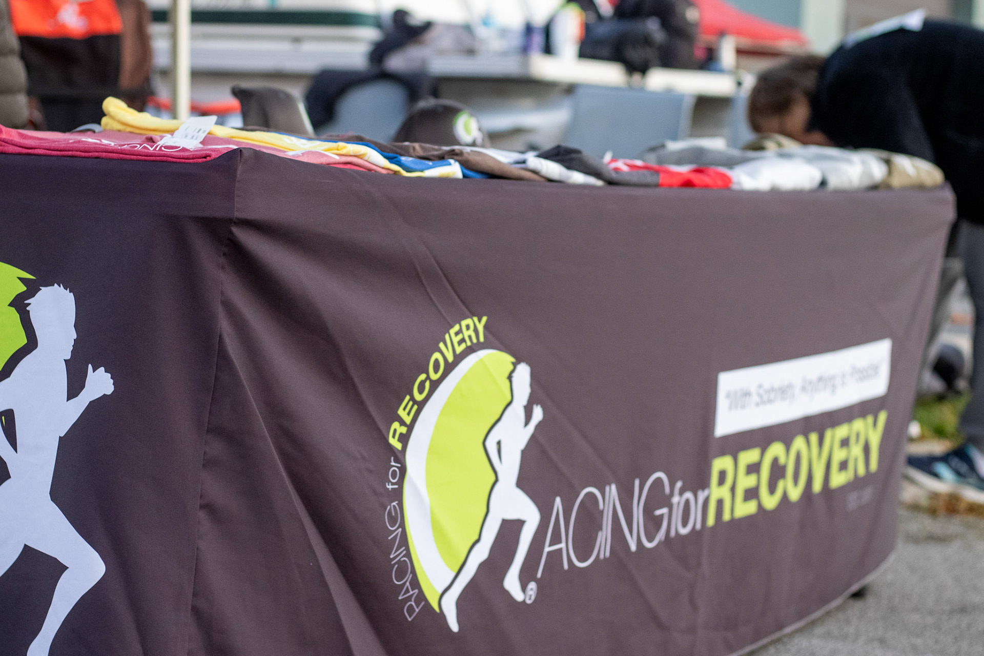Racing for Recovery merch table that was set out right on the corner of Osbourne and Superior.