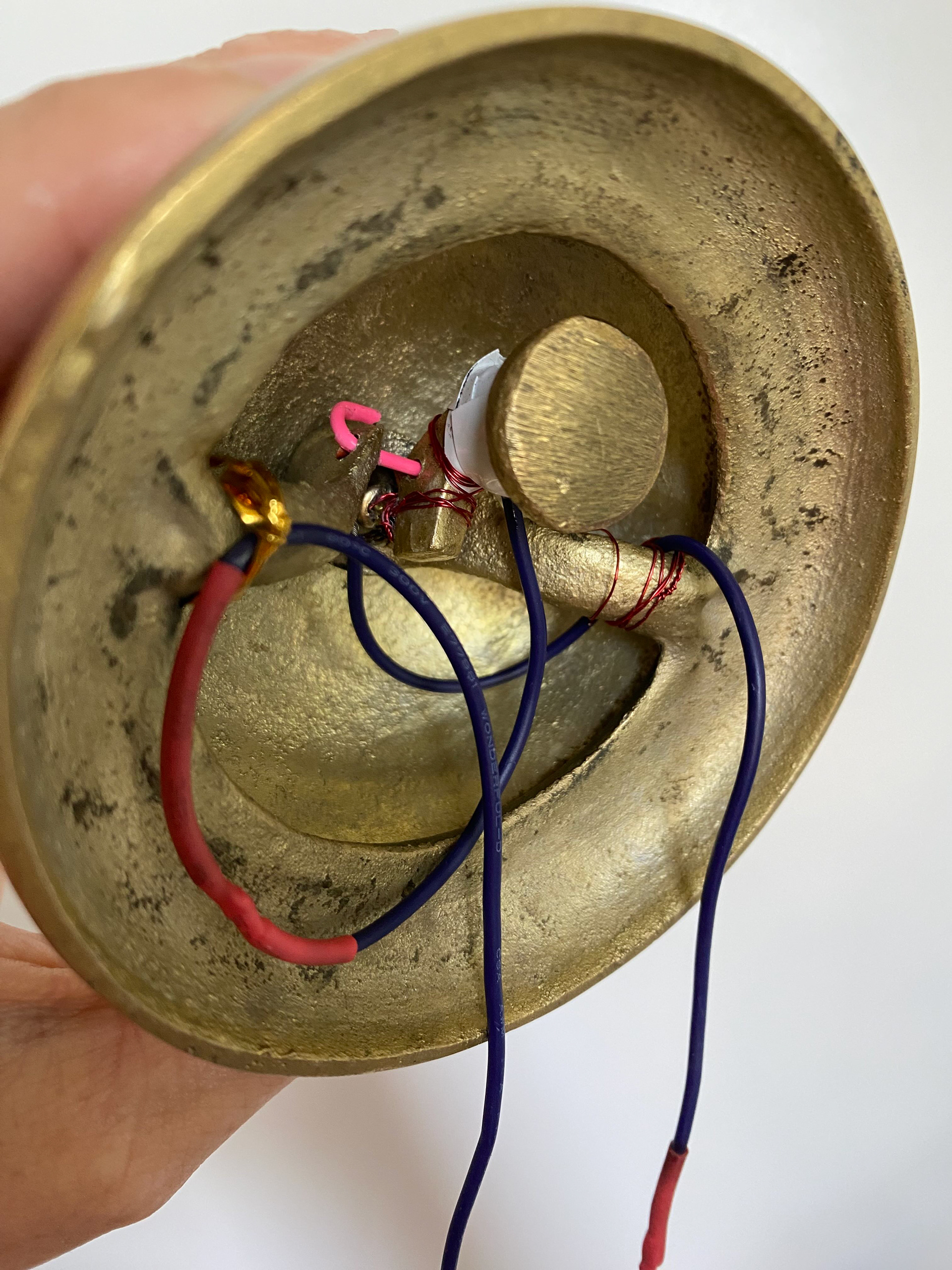 Wiring and components under the bell.
