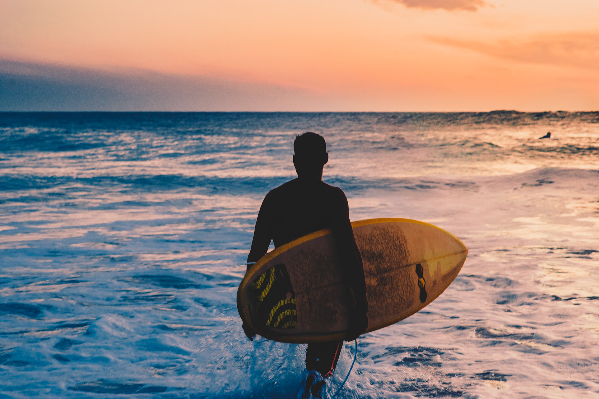 Surfer at sunrise