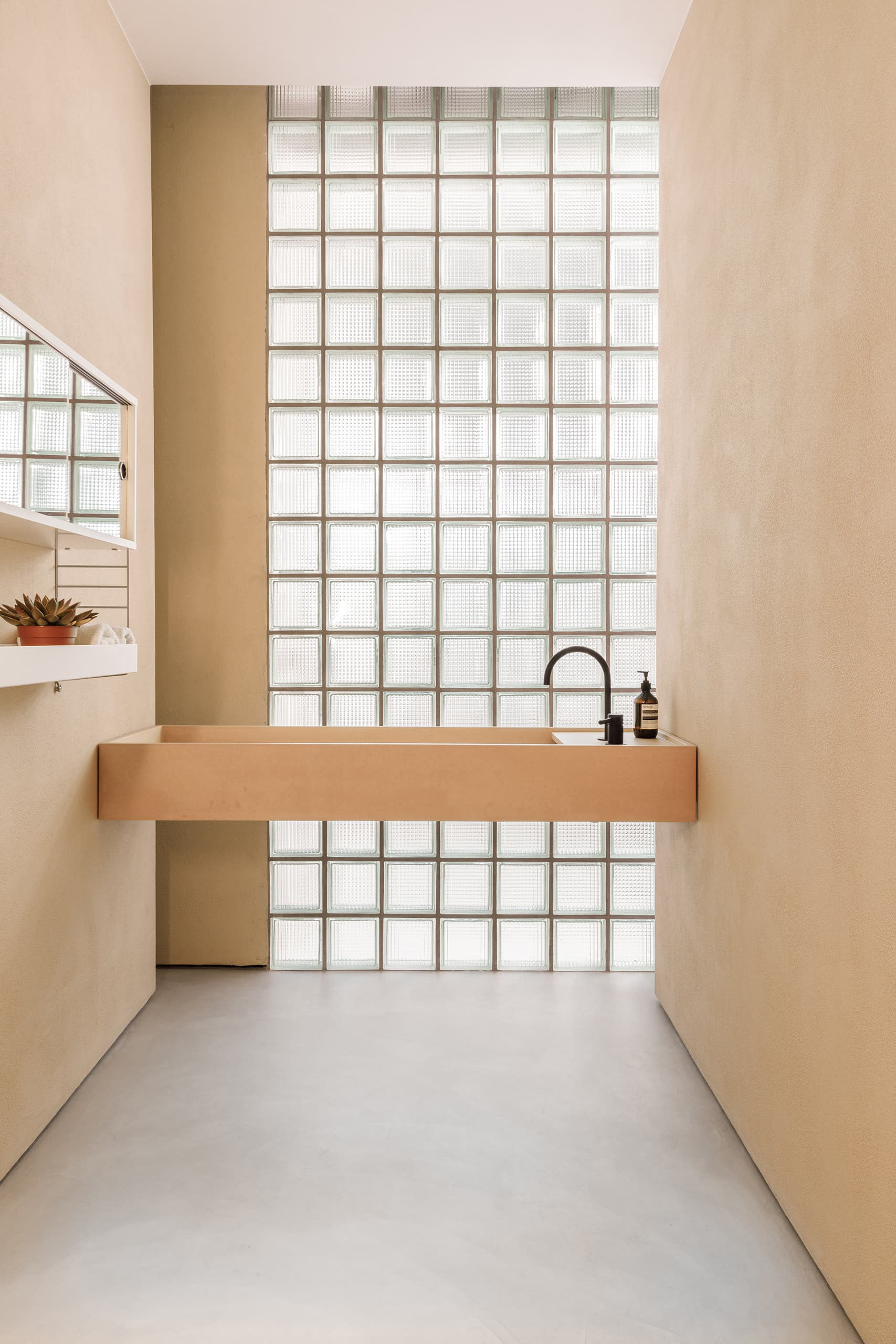 Glass blocks fill the bathrooms with disused light.