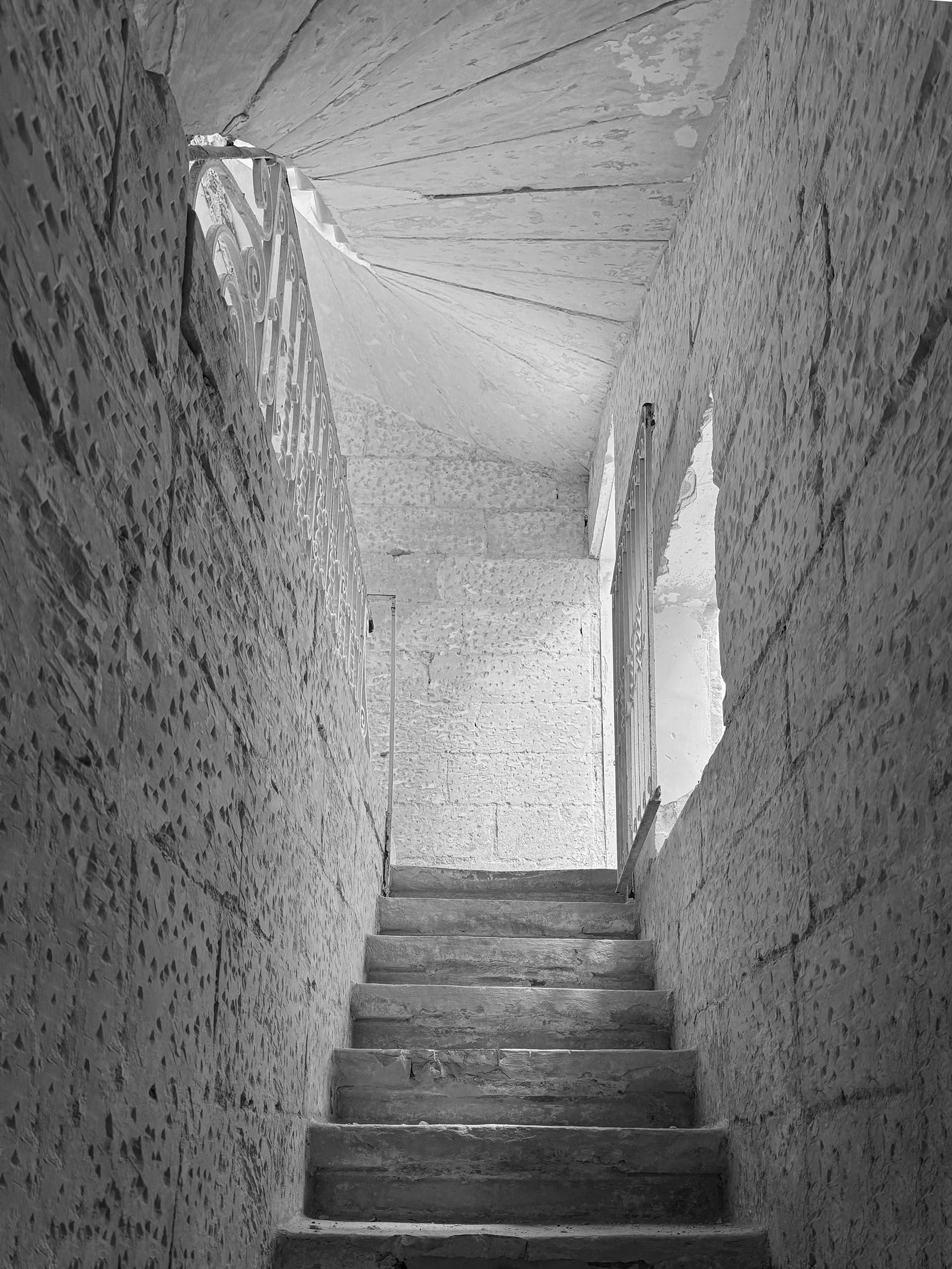 Limestone staircase leading to the basement.