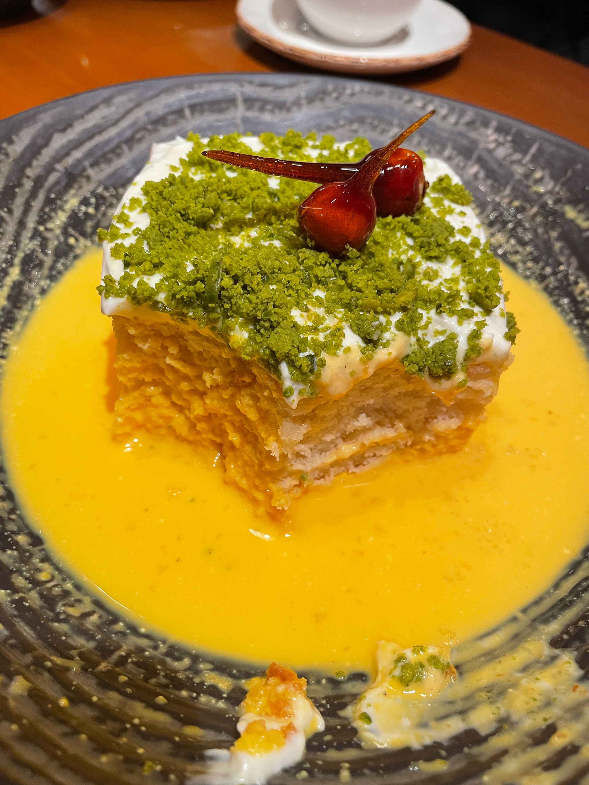 Saffron Milk Cake from Asha's in Kuwait. Heavy on the cardamom, and the cake itself isn't particularly milky (note the right half which is dry).