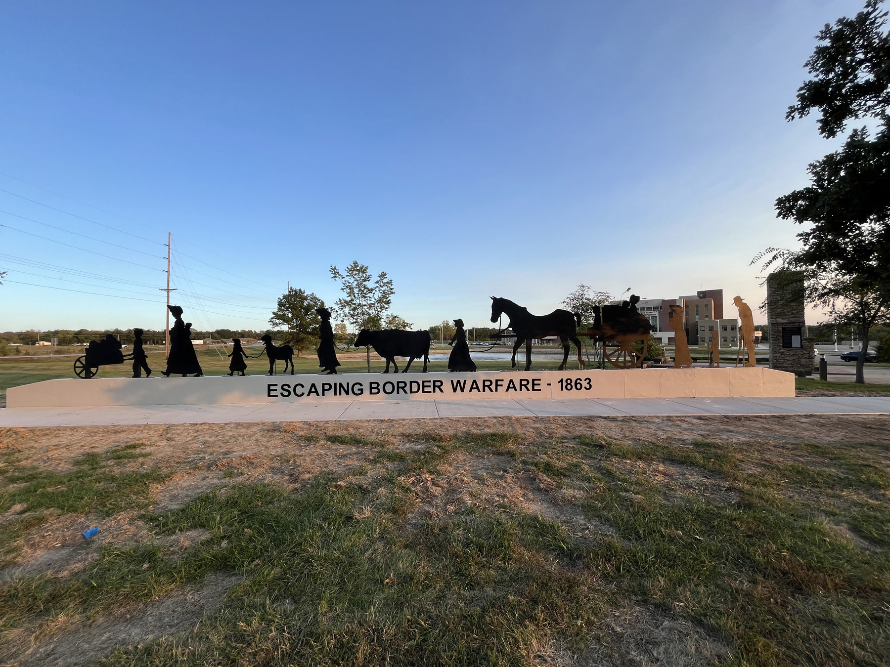 Stands in front of the Justice Center in Harrisonville, MO 67401
