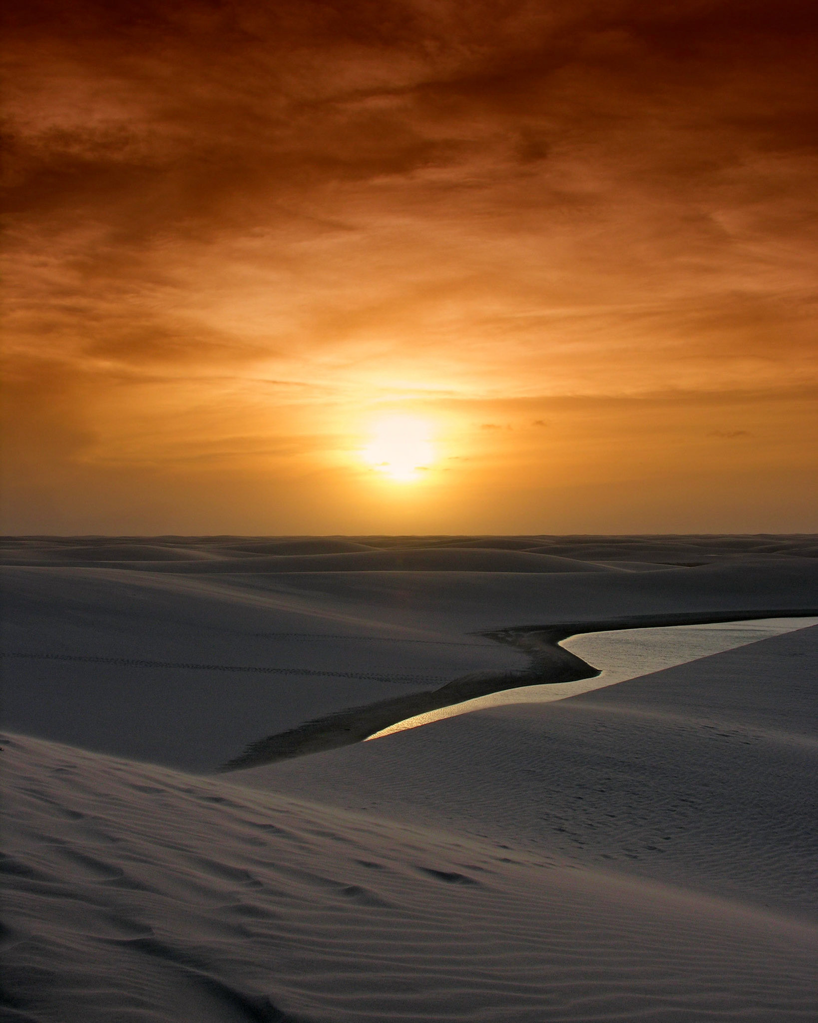 Sun sets over the Grandes Lençóis dunes. Lençóis Maranhenses National Park, Brazil2005
