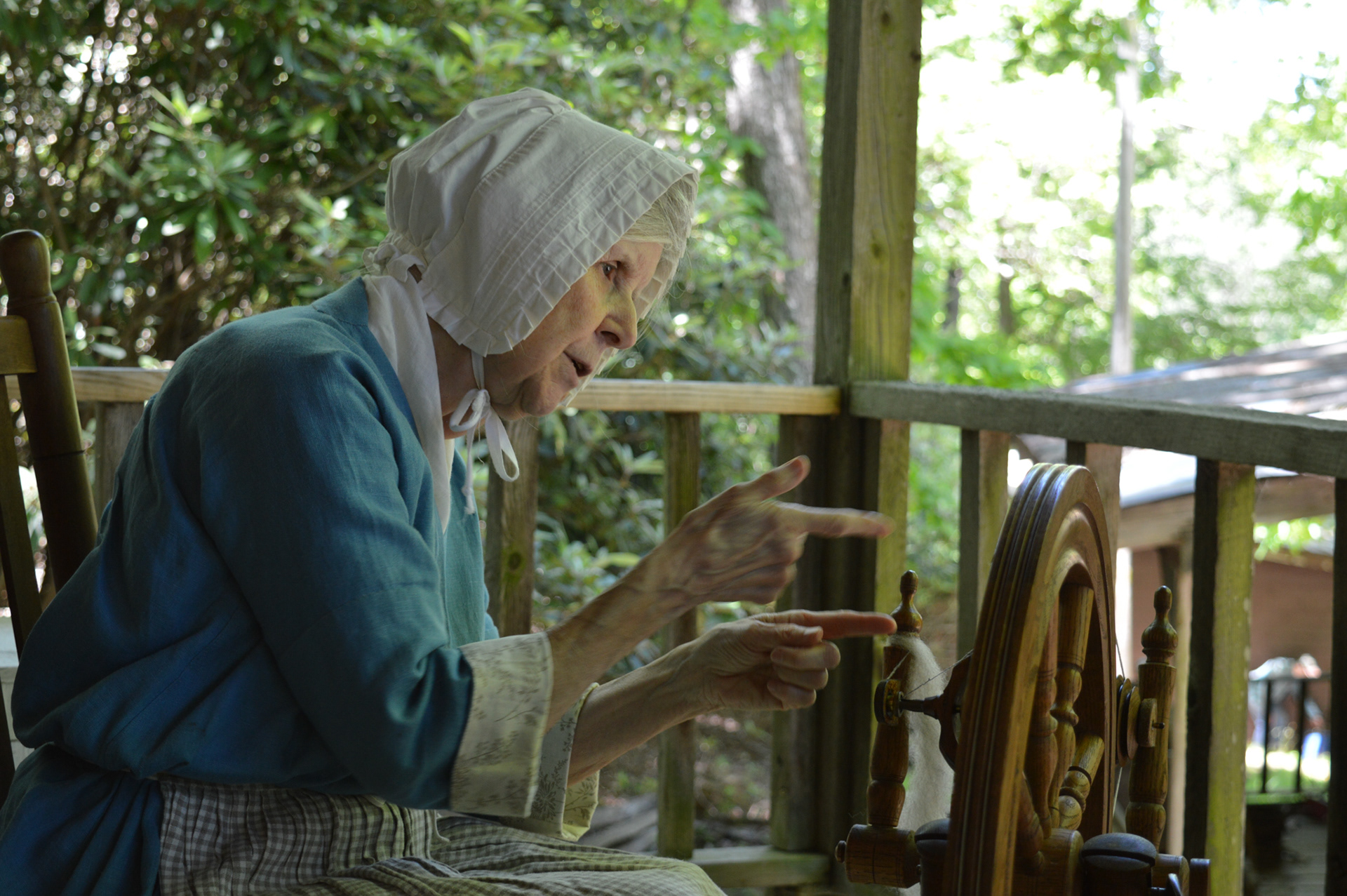 Debby Stone demonstrates colonial-era wool spinning