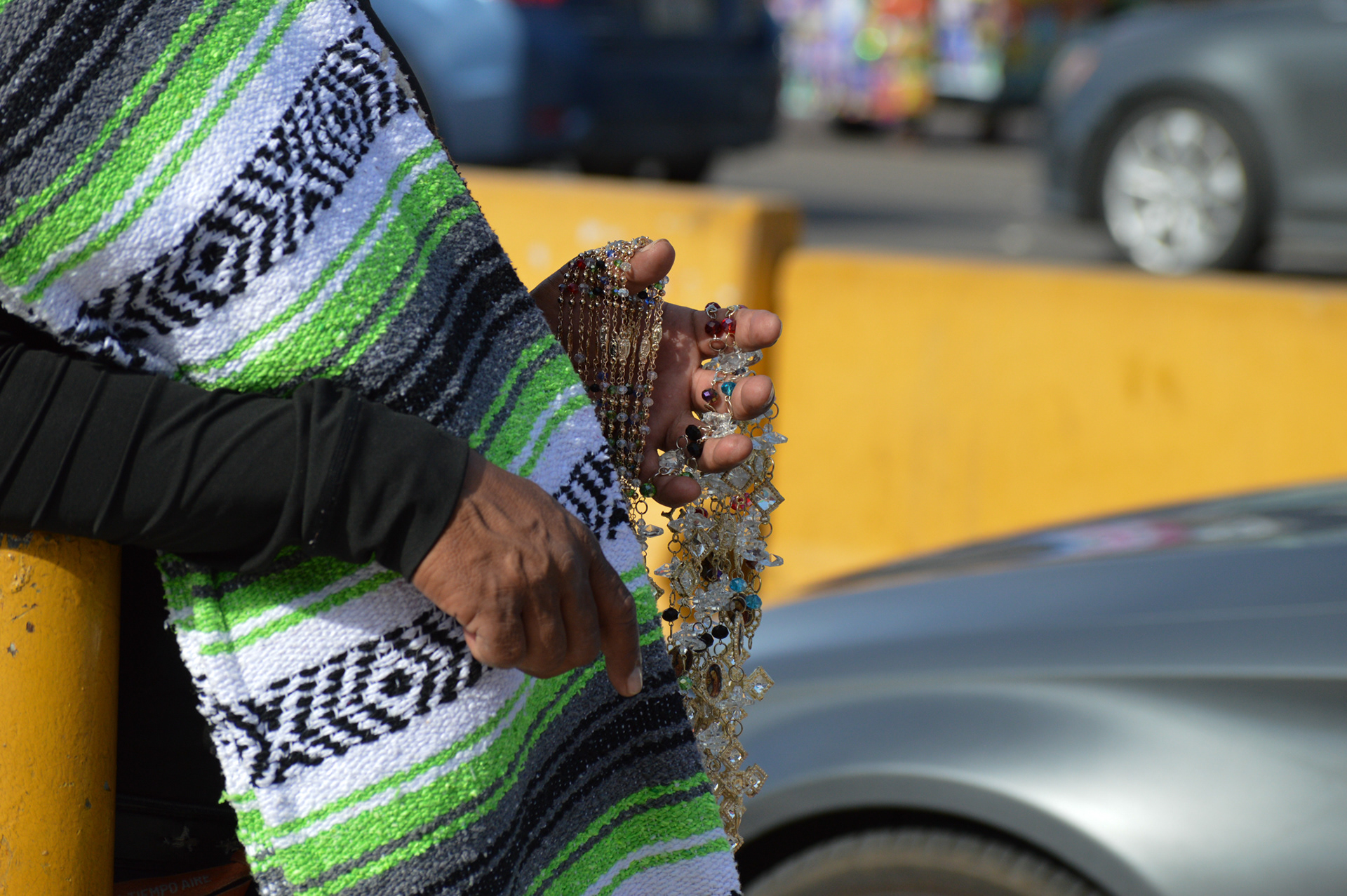 A man sells jewelry at the San Ysidro Port of Entry.