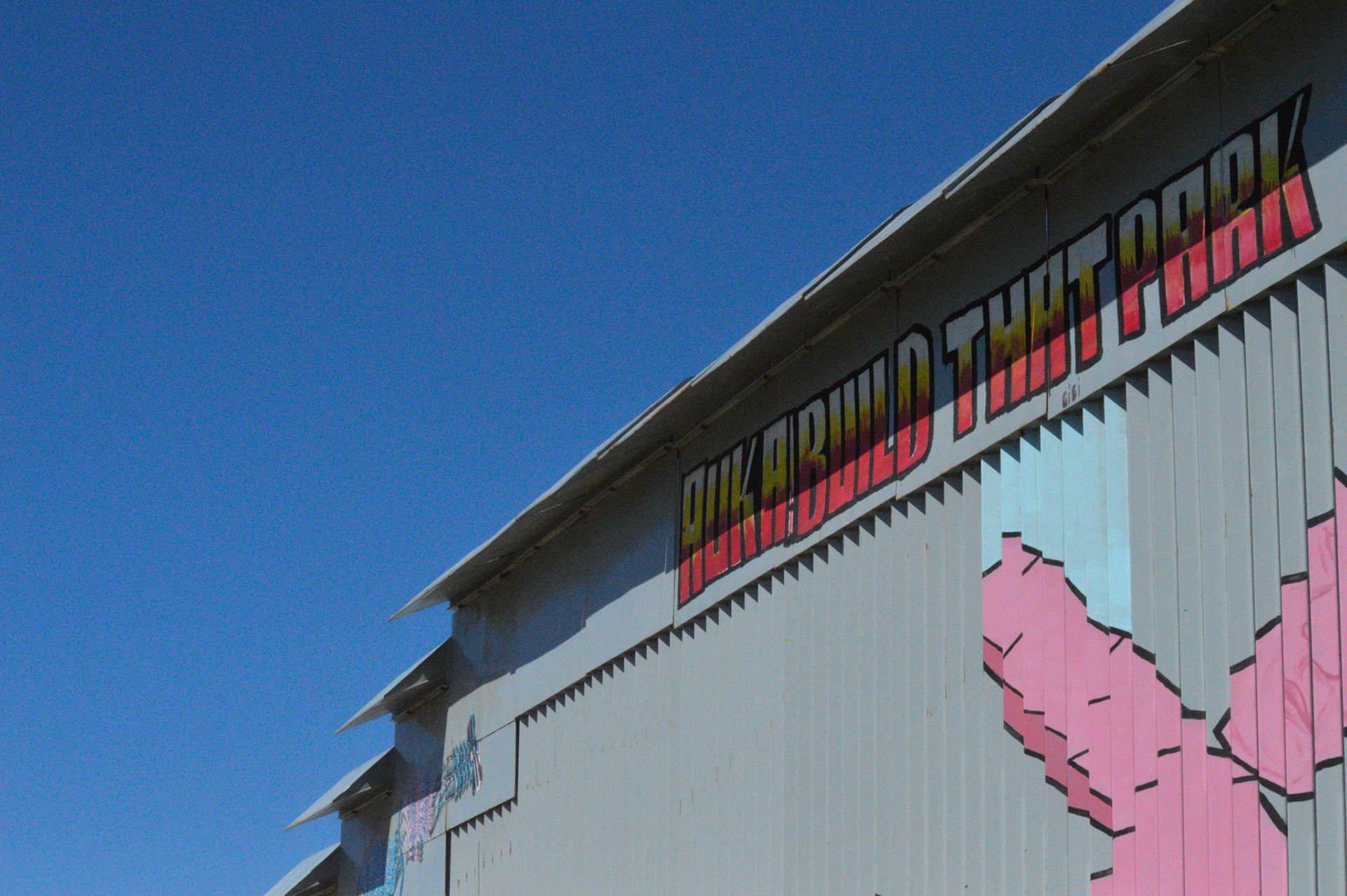 The wall in friendship park is covered in murals and paintings, like the ones pictured here.