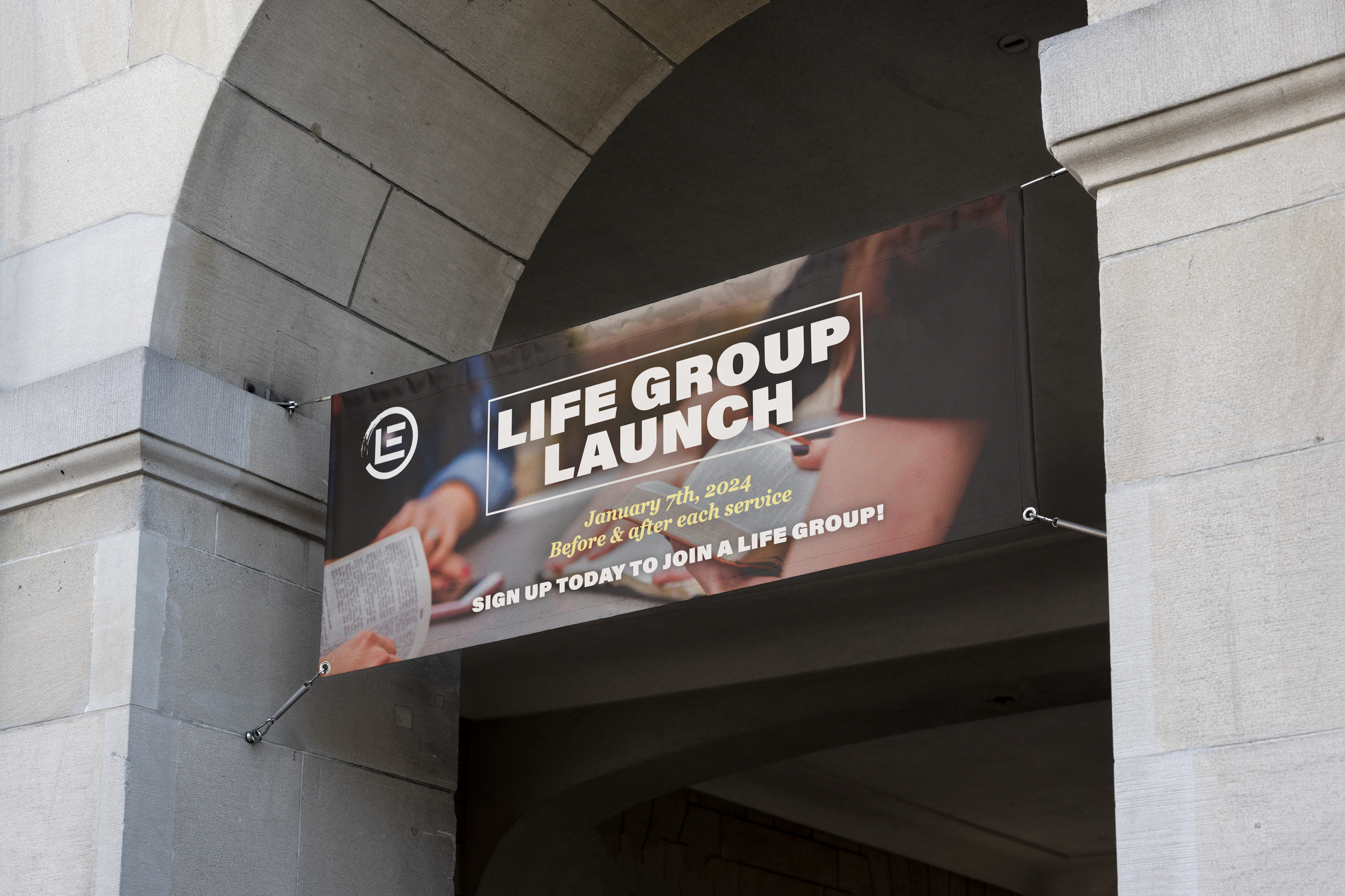 Hanging outdoor banner advertising the Life Group Launch.