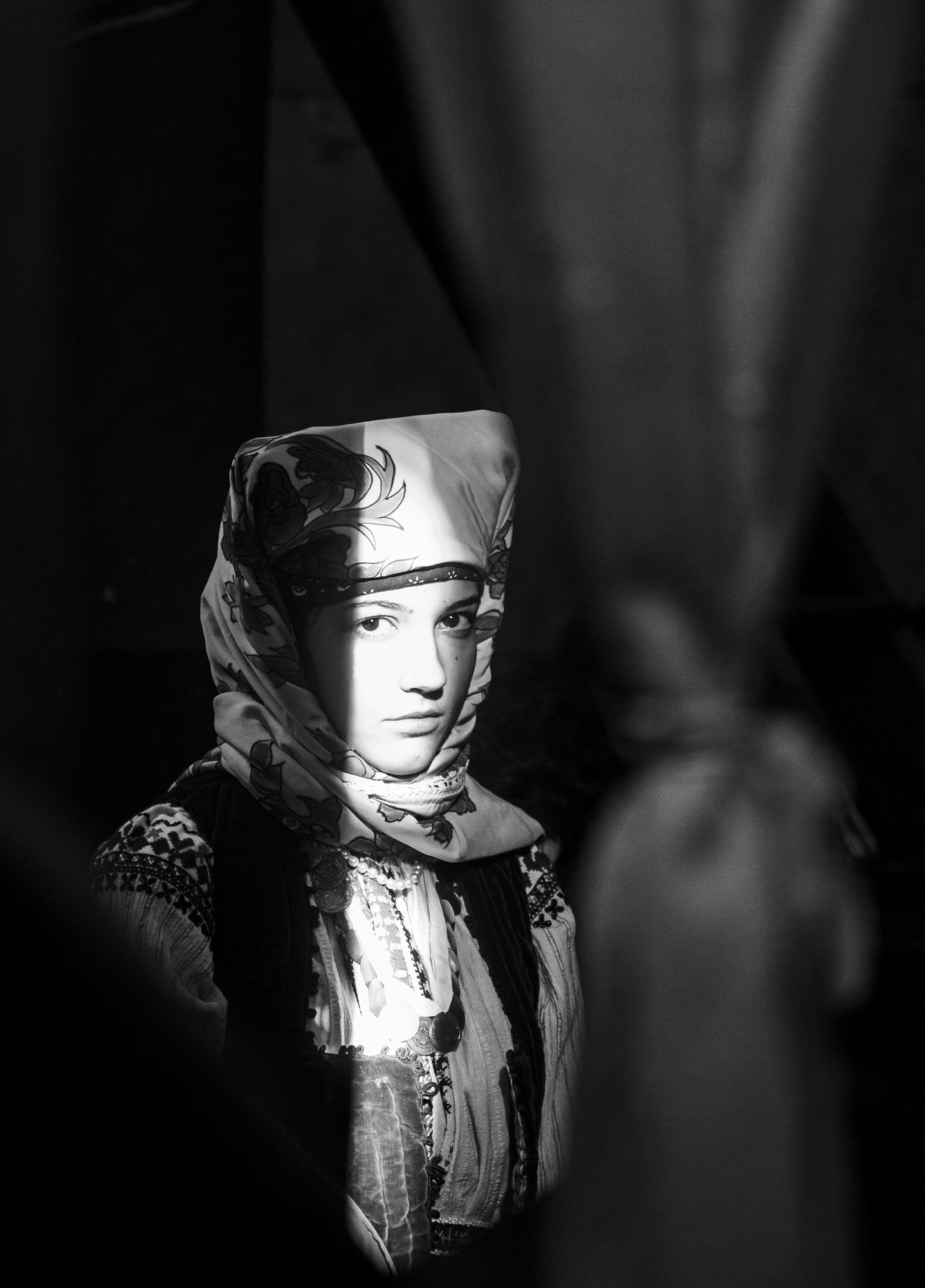 A girl dressed in traditional North-Eastern Bulgarian clothing, a guest at the celebrations.