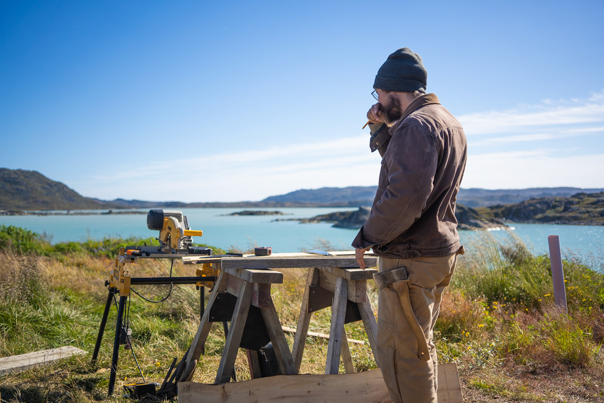 Carson woodworking outside the station on a beautiful day in August.