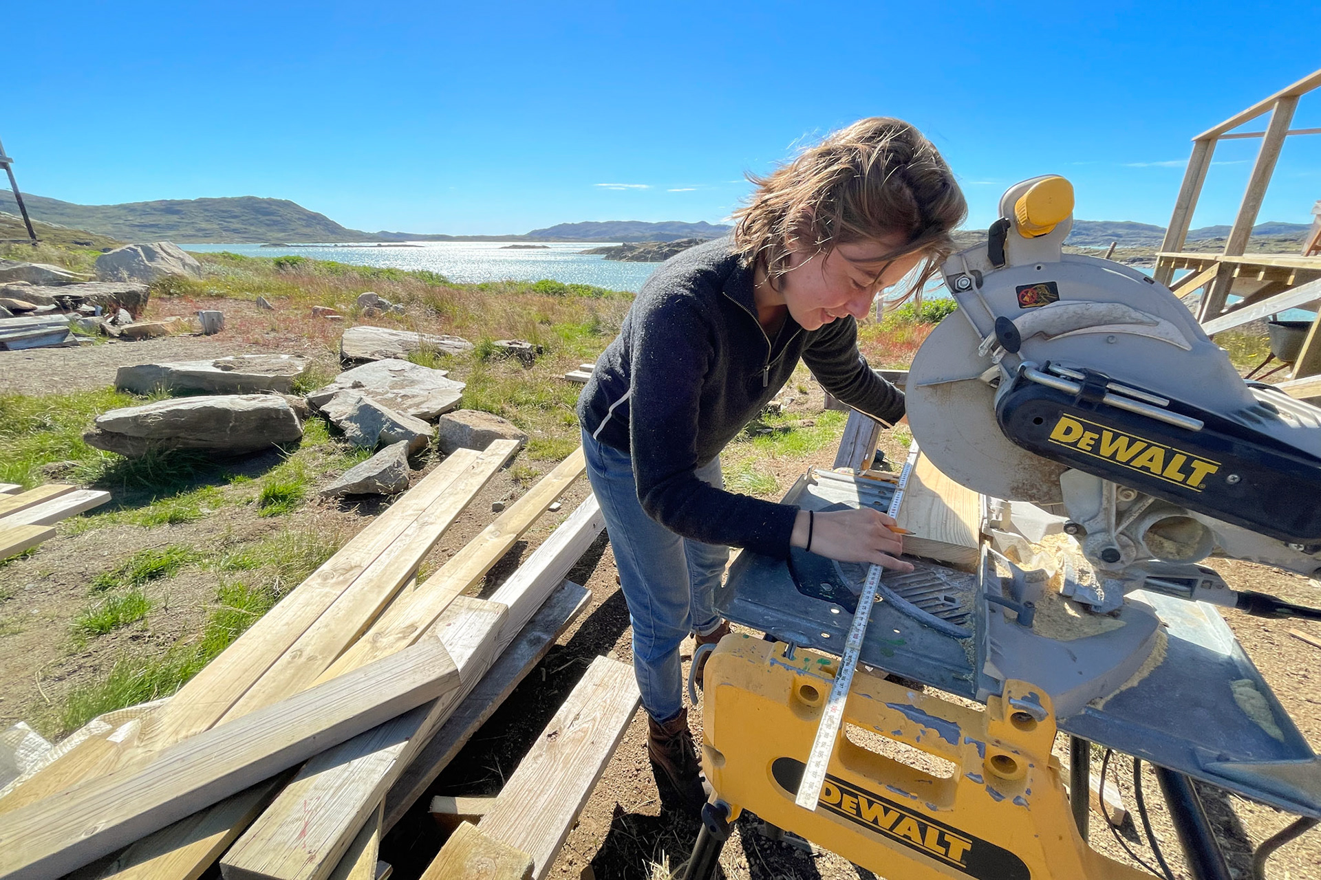 Working on fixing up the deck, one of Carson and I's projects at Isortoq. (Photo by Carson Brown)