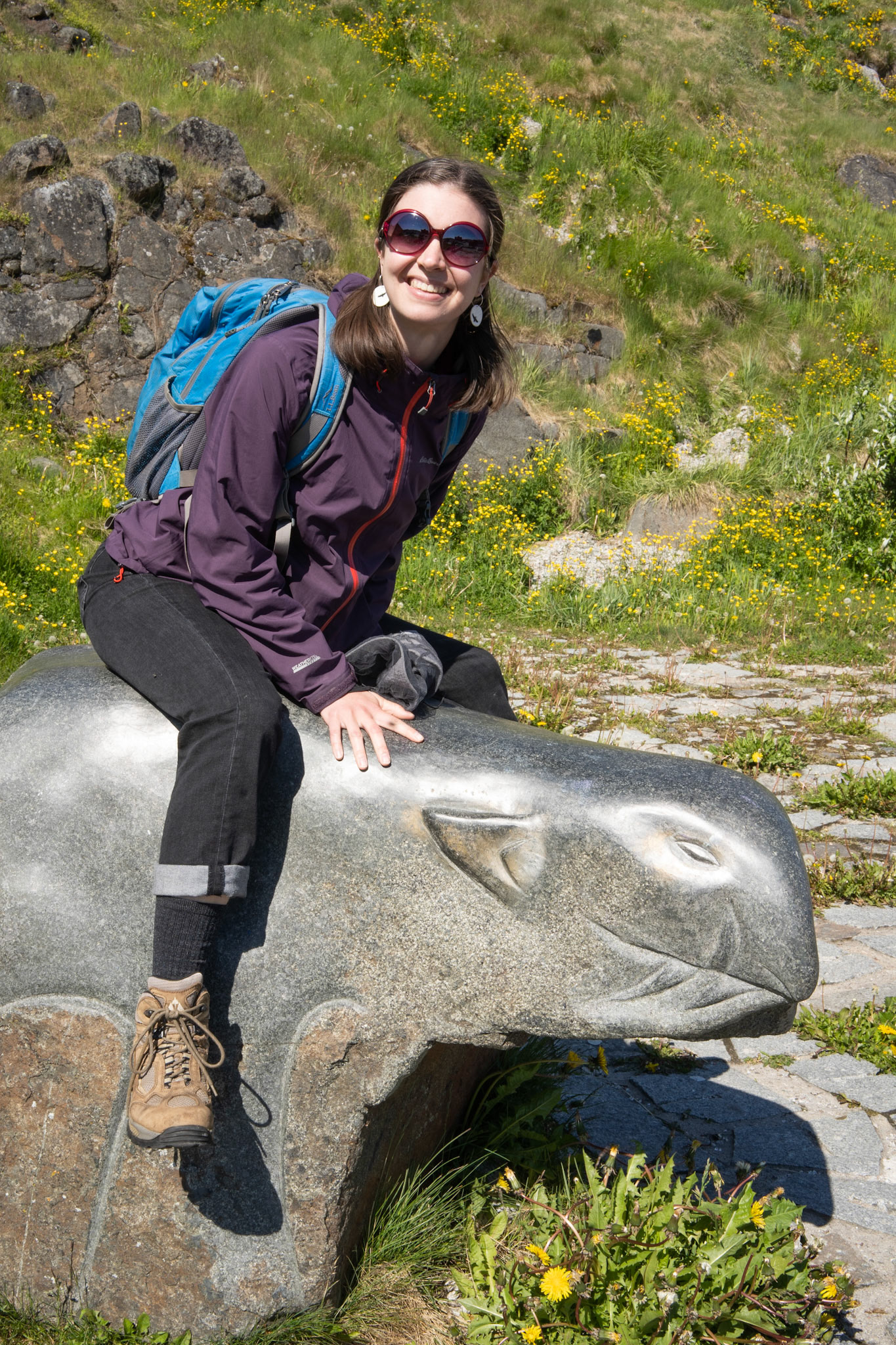 Julia enjoying a stone carving with her new Puuki Pottery earrings.