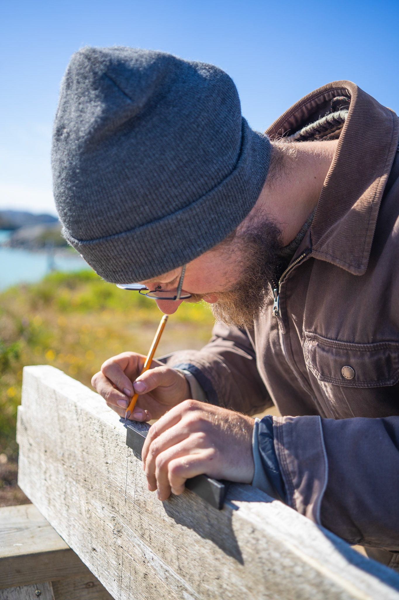 Carson at work, building a shelf to use for firewood.