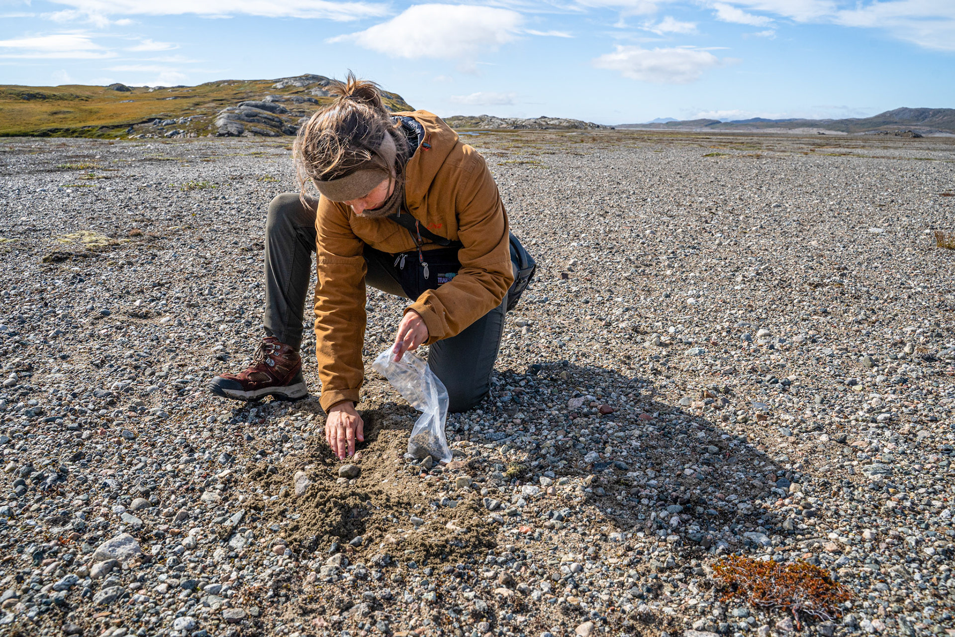 Collecting a soil sample. (Photo by Carson Brown)