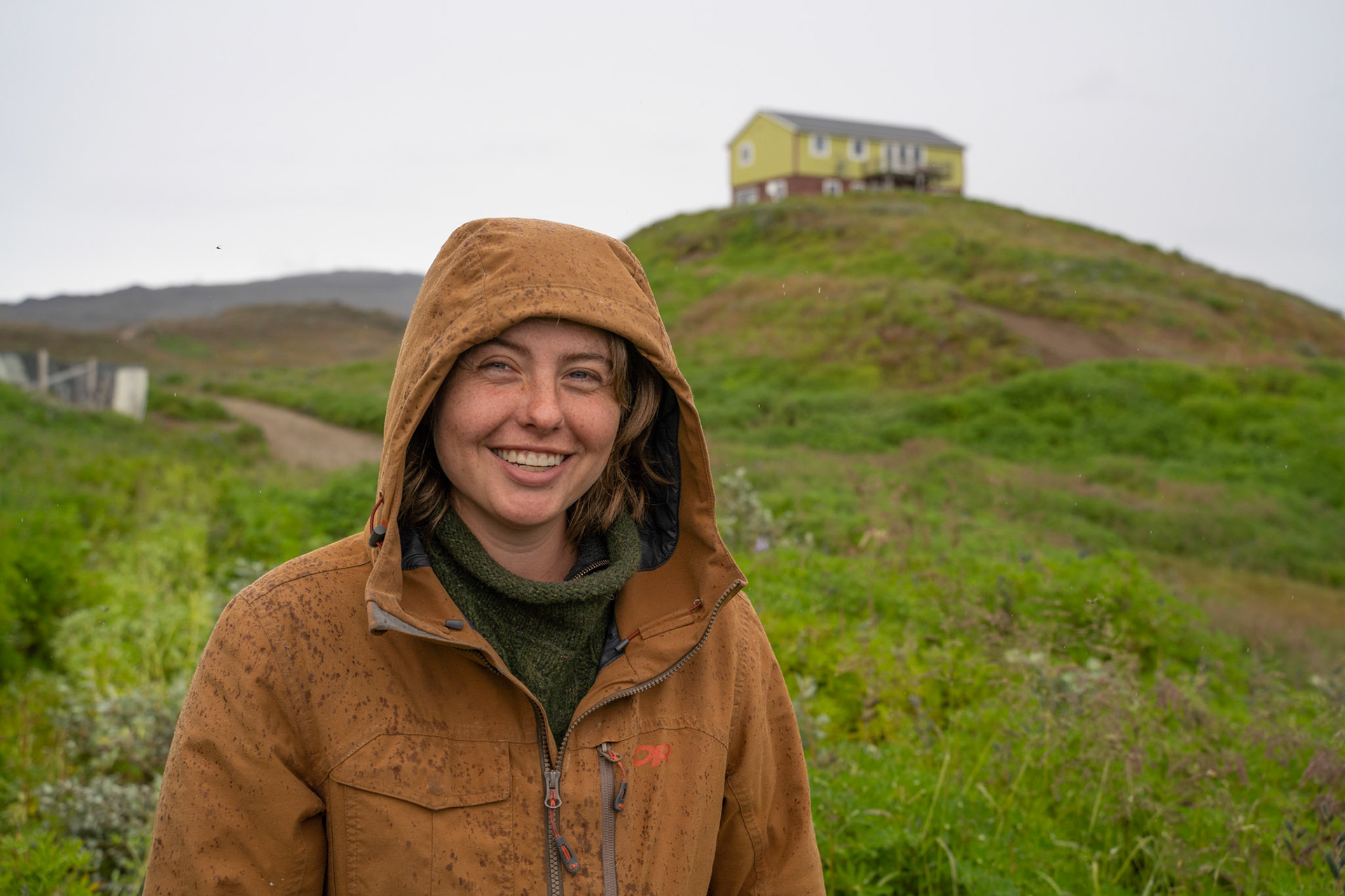 Outside in some rain at the station. Stefan and Freyja's house is up on the hill behind me. We were collecting wild willow to use in bark tanning reindeer and sheep skins. (Photo by Carson Brown)
