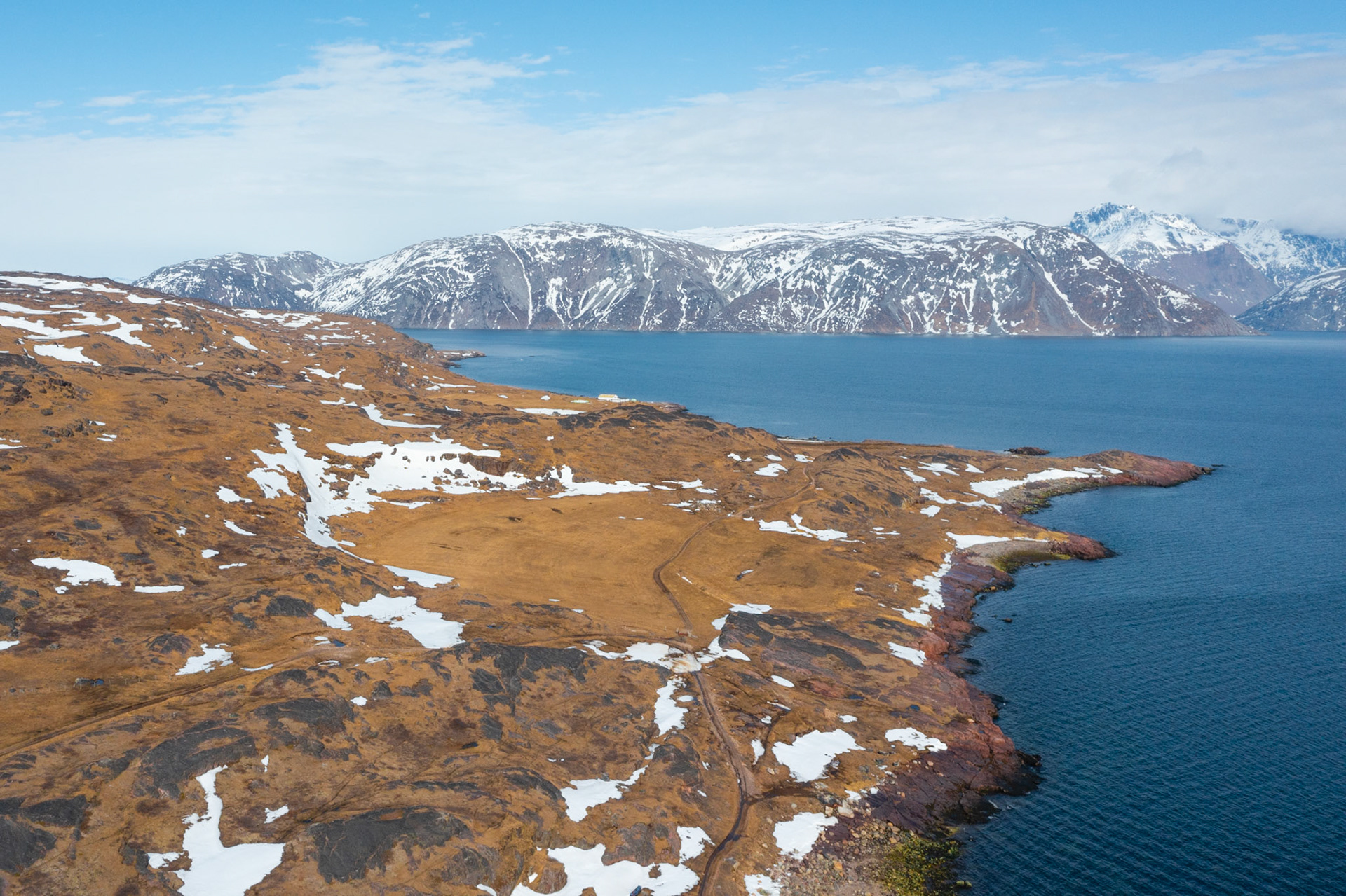 Hayfield from above on the drone, still brown at this point in the spring.