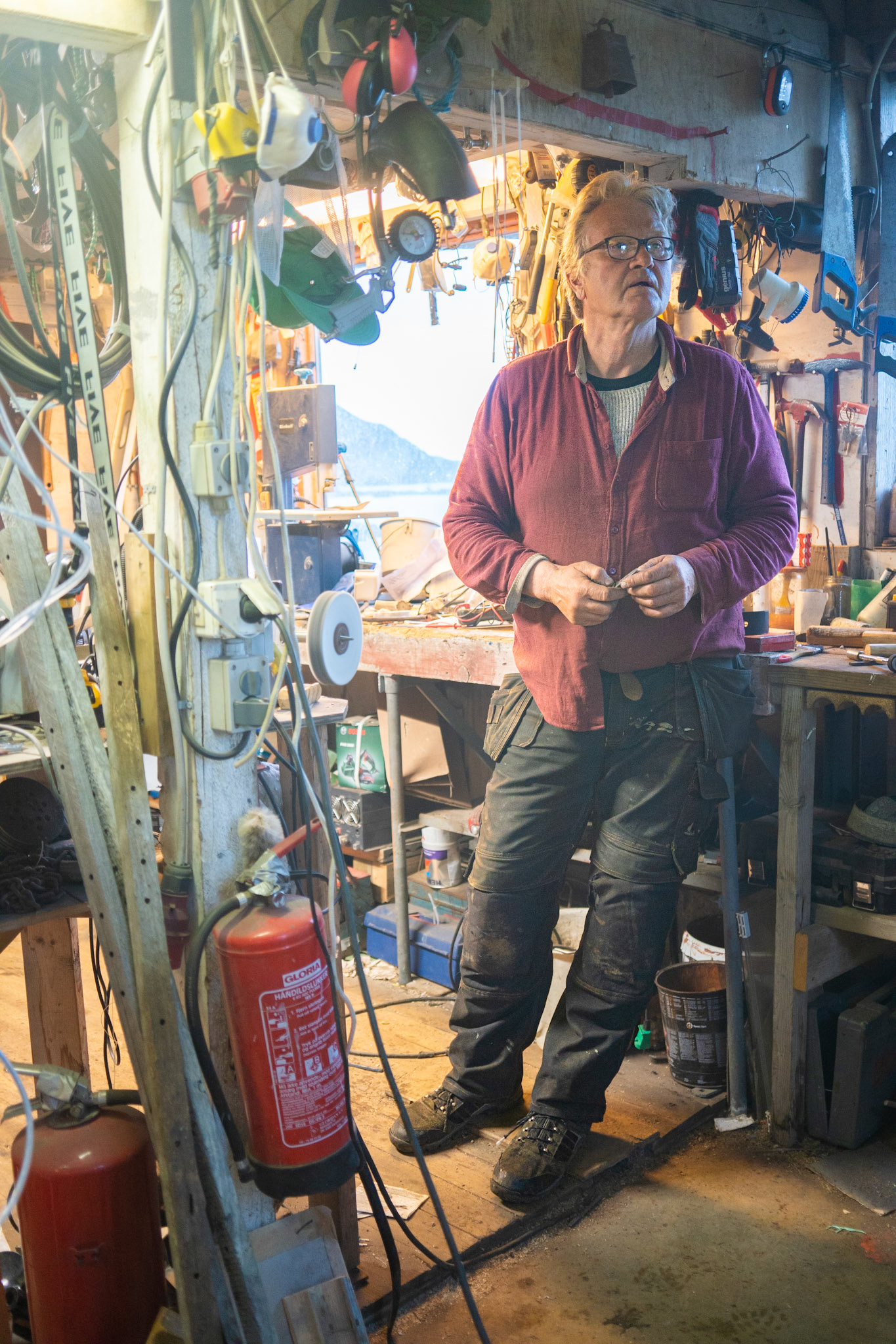 Stefan in his shop. Stefan is a self-taught builder, electrician, plumber, meechanic, blacksmith, etc.