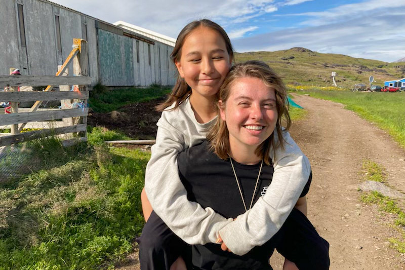 Kira and I reunited! Like everyday we are together, Kira wants a piggyback ride. (Taken by Judy)