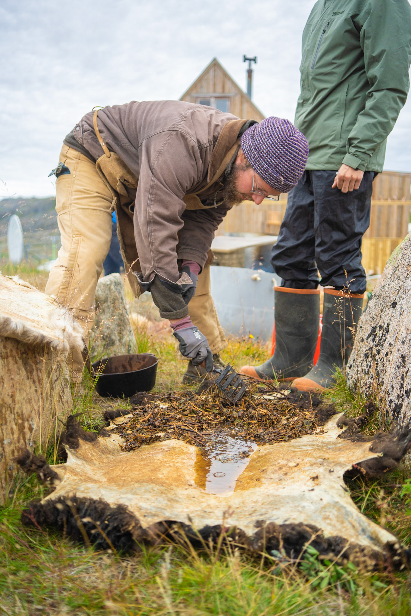 Carson tanning a sheep skin with boiled willow bark we collected from around the station. Carson, David, and I all learned how to tan skins at the station.