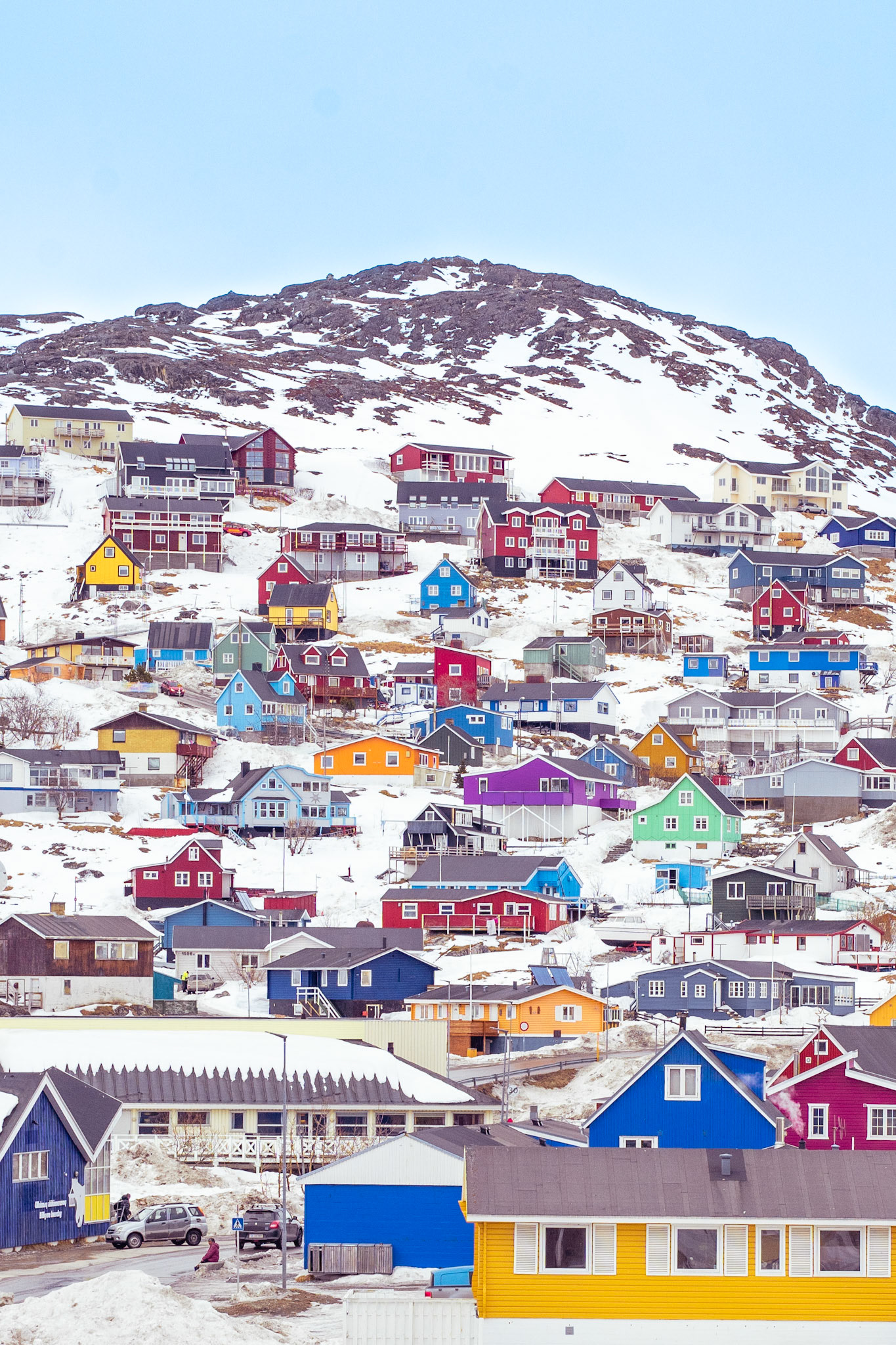 Houses up up and up. Living at the top can mean seeing the fog roll in from across the mountains by the sea and the best view of the northern lights. It also means that you may be in the mountain fog while the sun's out in the harbor!