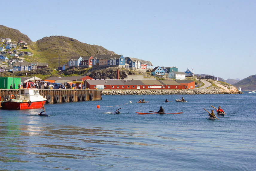 National day qajaq show, including qajaq rolls, in the harbor of Qaqortoq.