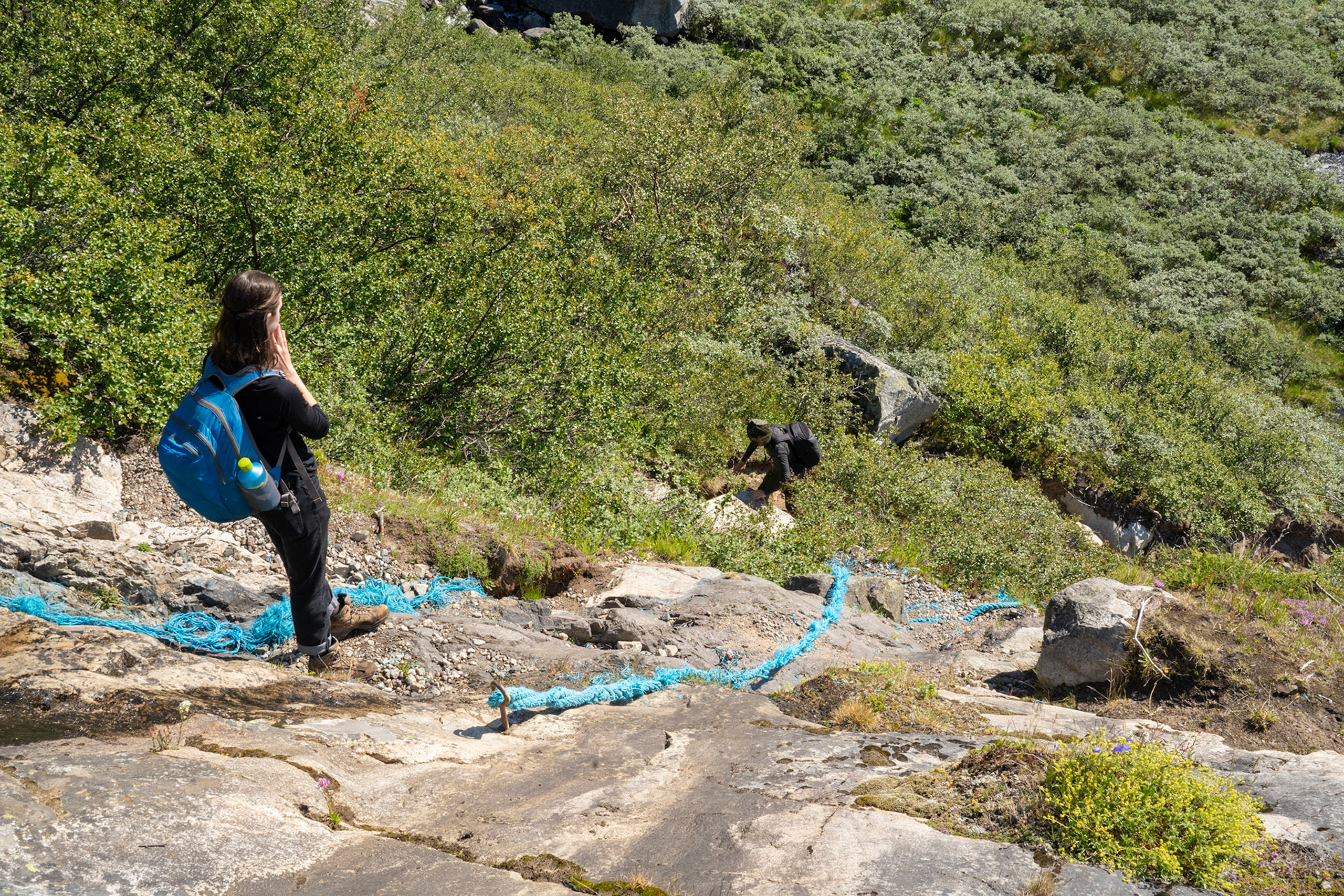 Near-vertical piece of the trail. Julia and Arina climbing up.