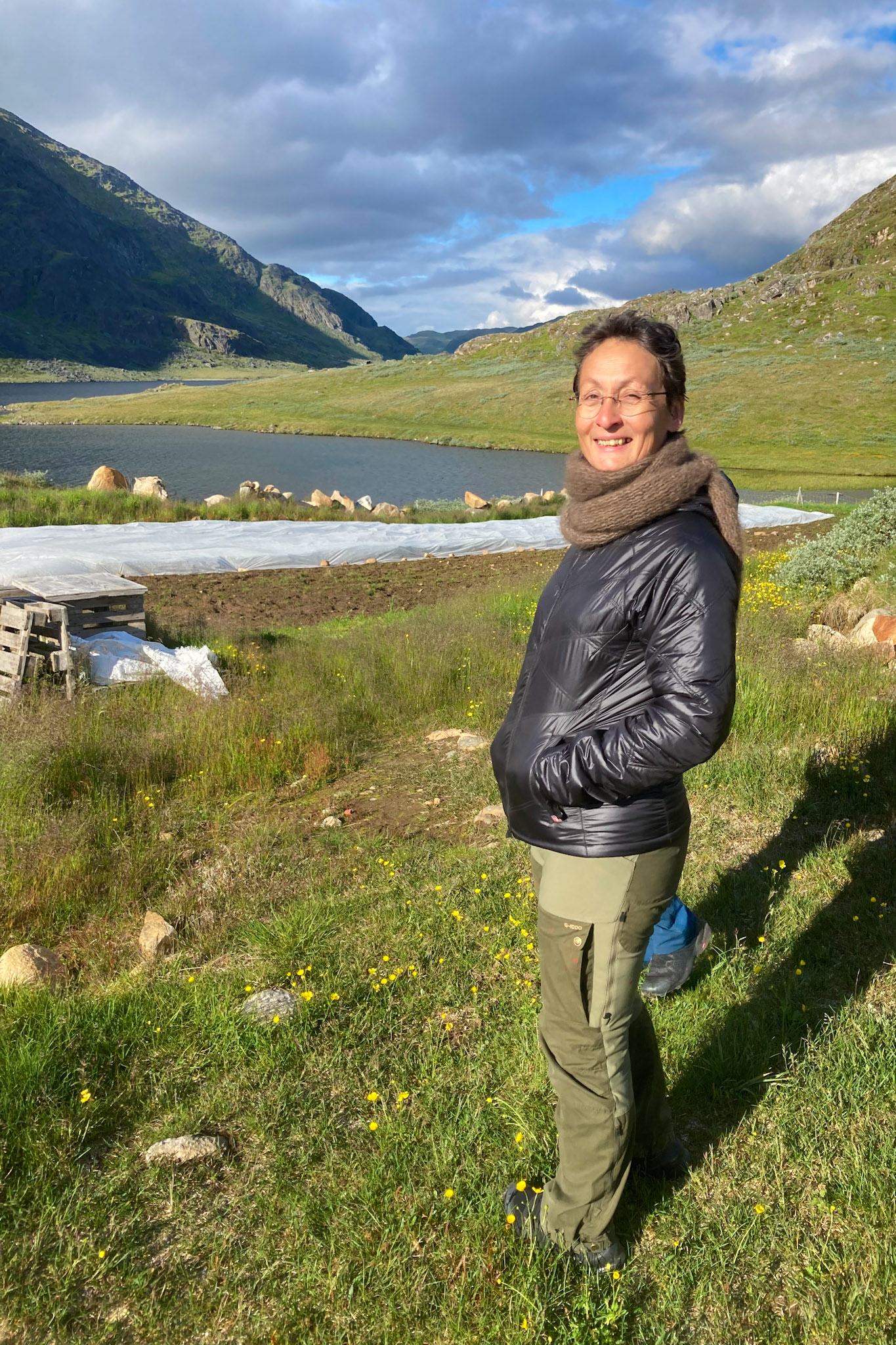 Arnaq giving me a tour of the gardens at Eqaluit Akia, where we attended a kaffemik. (Taken on my phone)