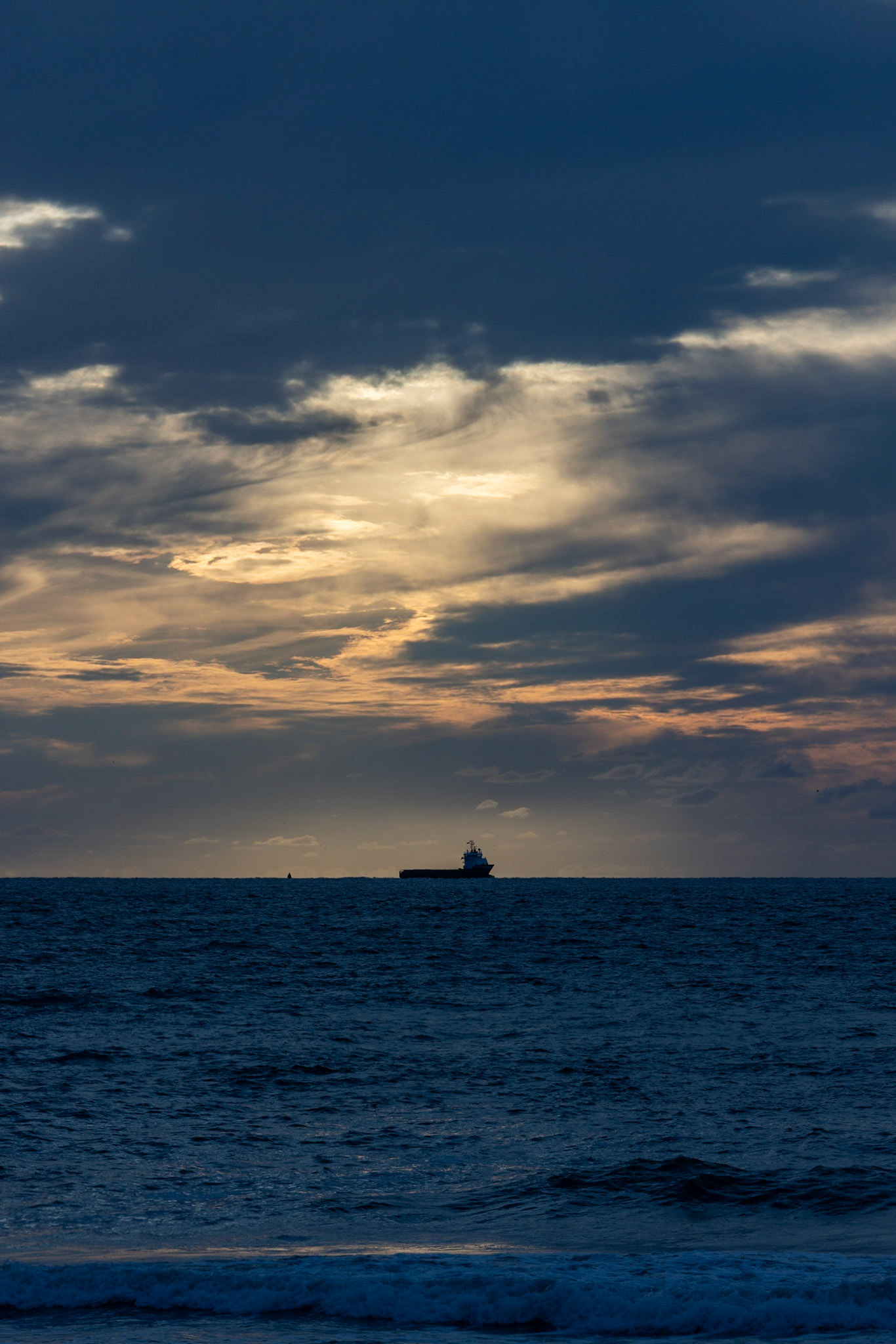 transport ship with the sunset in the background
