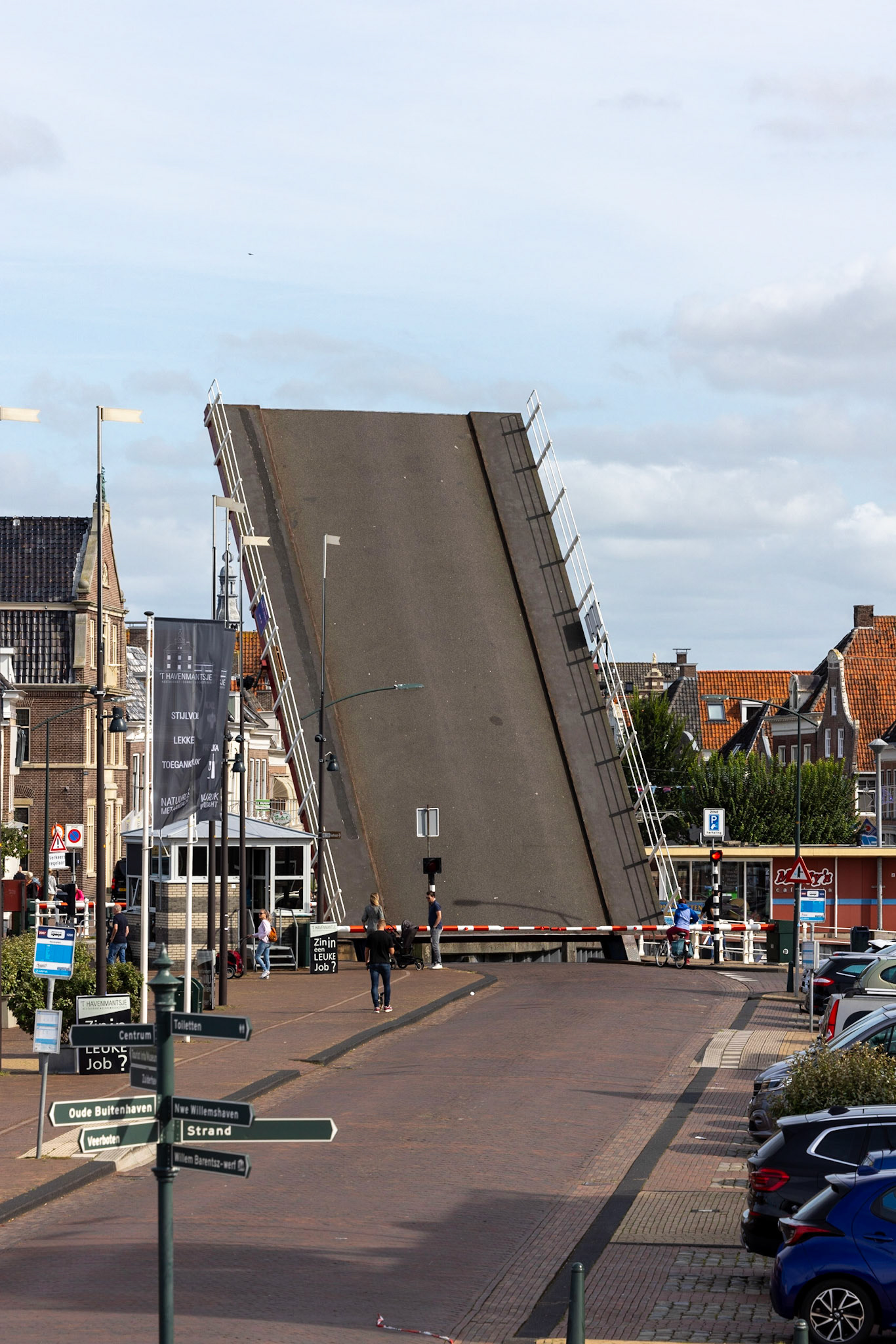 the drawbridge in harlingen harbor. the sailboats are already waiting for departure