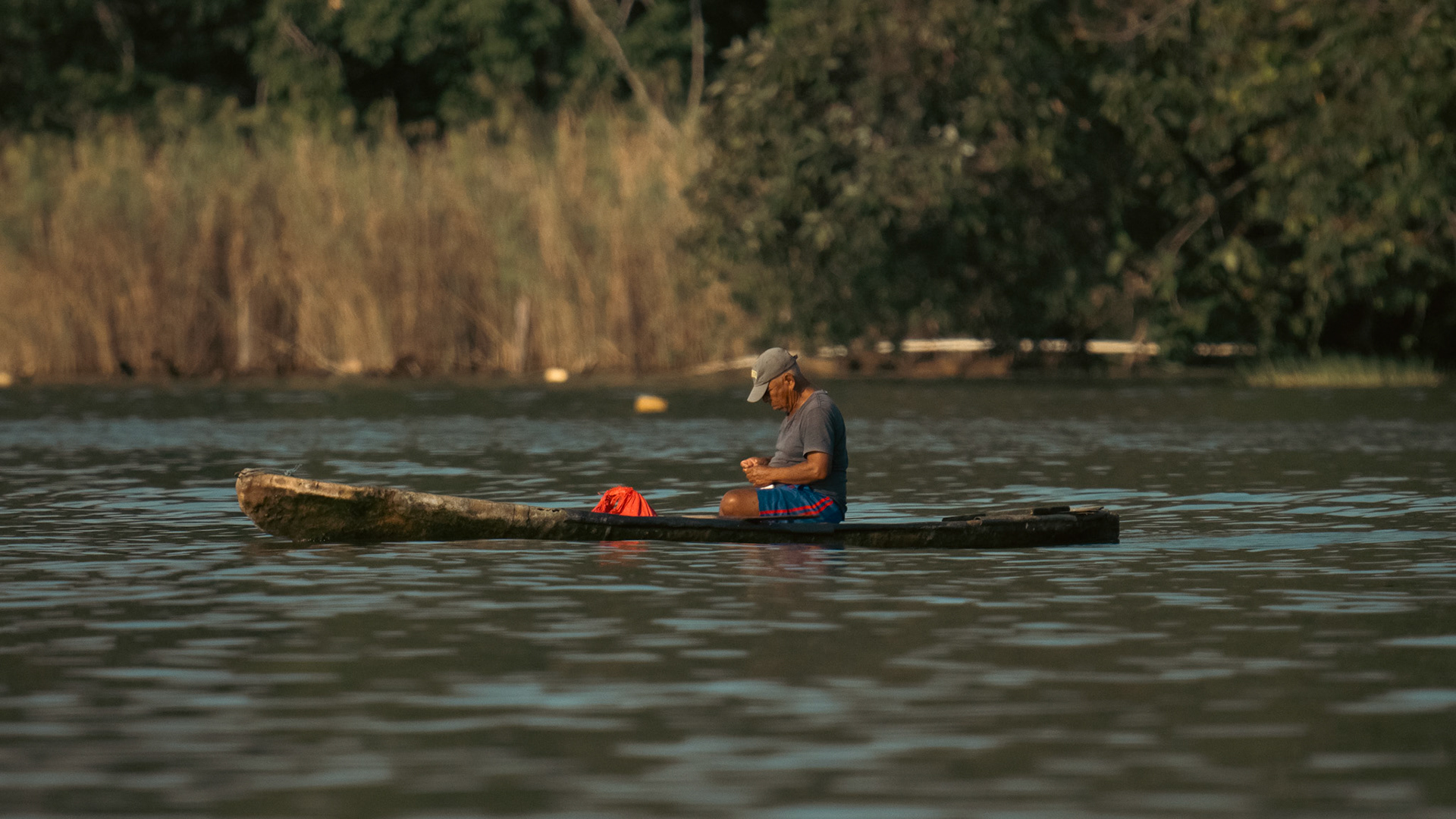 A local Guatemalan fishing crabs in the Rio Dulce River.