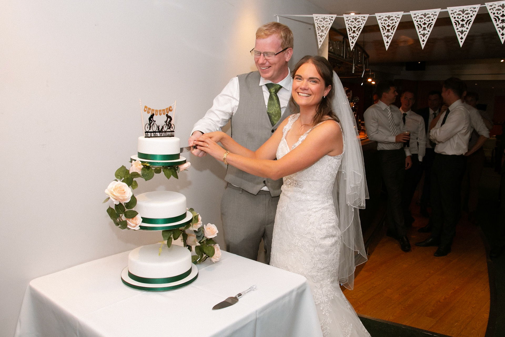 Mark and Rosemary celebrating with family and friends at their wedding reception at Bulbury Woods Golf Club in Dorset.