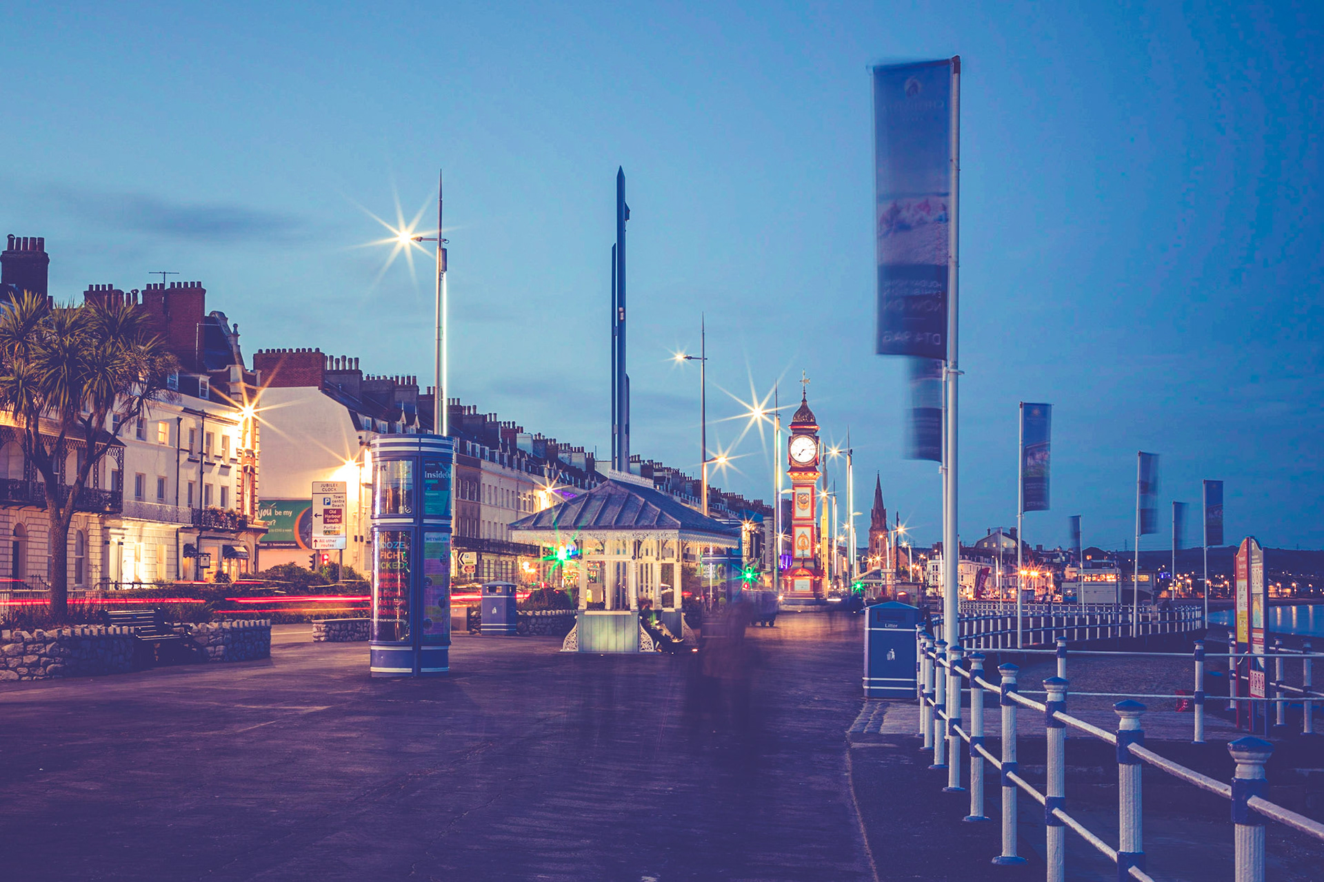 Weymouth in Dorset and part of the jurassic coast with it's beautiful Georgian Seafront featuring the famous Jubilee Clock at sunset in autumn.