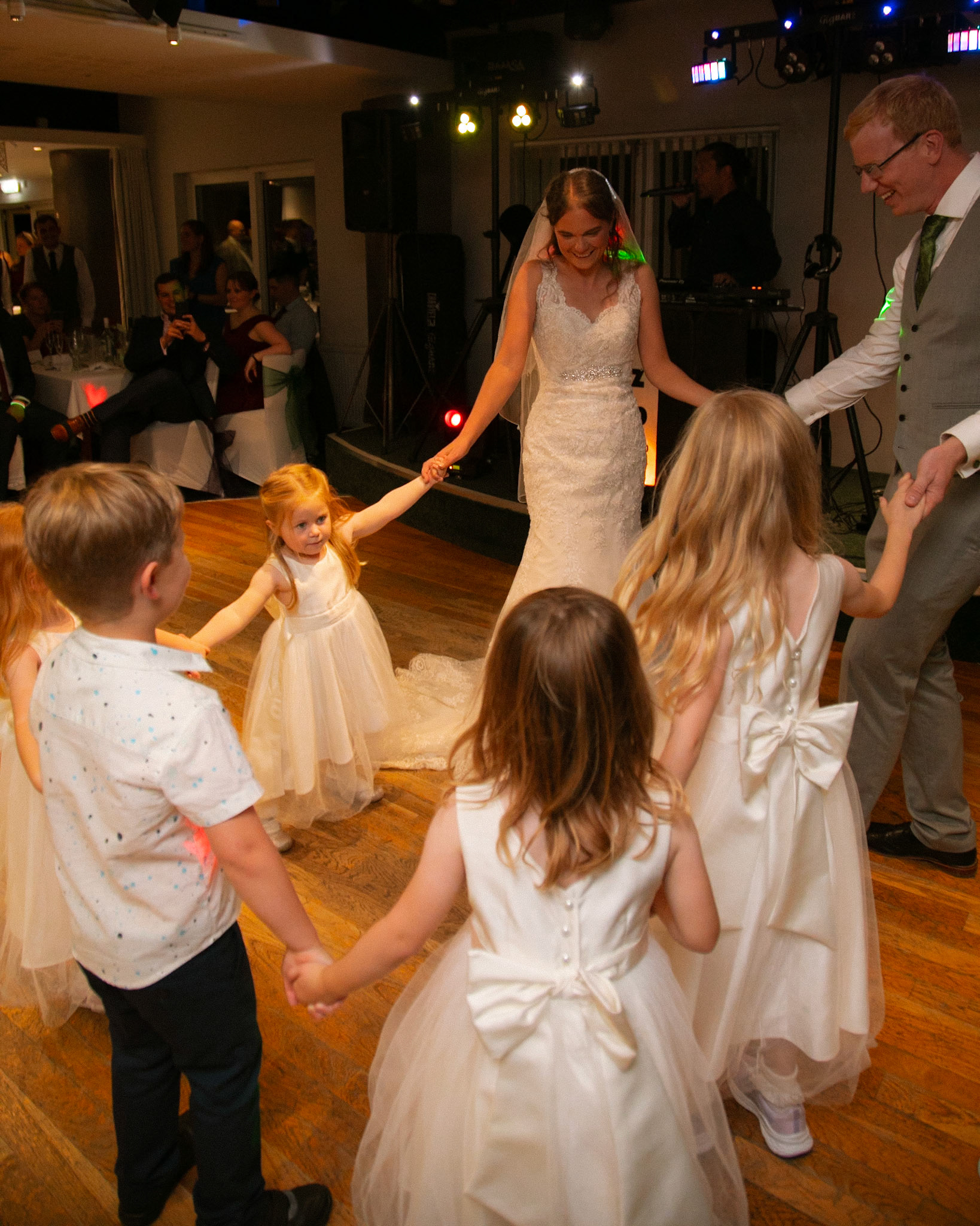 Mark and Rosemary celebrating with family and friends at their wedding reception at Bulbury Woods Golf Club in Dorset.