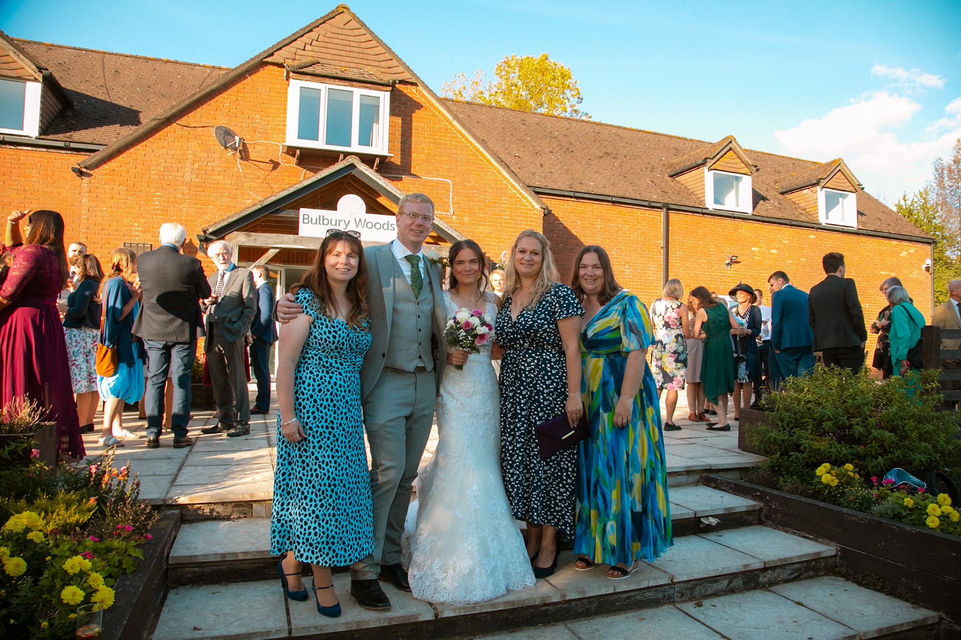 Mark and Rosemary celebrating with family and friends at their wedding reception at Bulbury Woods Golf Club in Dorset.