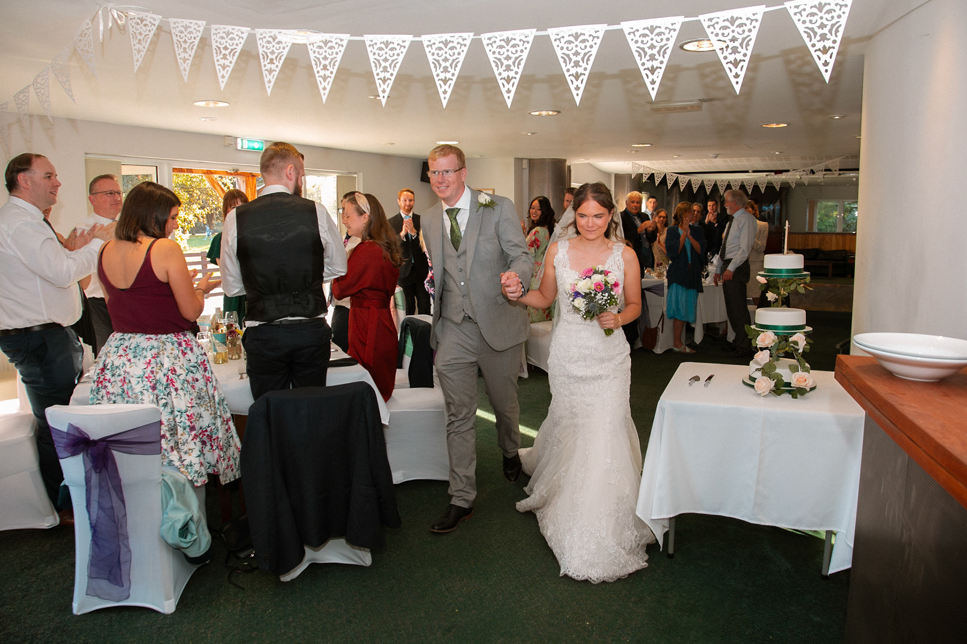Mark and Rosemary celebrating with family and friends at their wedding reception at Bulbury Woods Golf Club in Dorset.