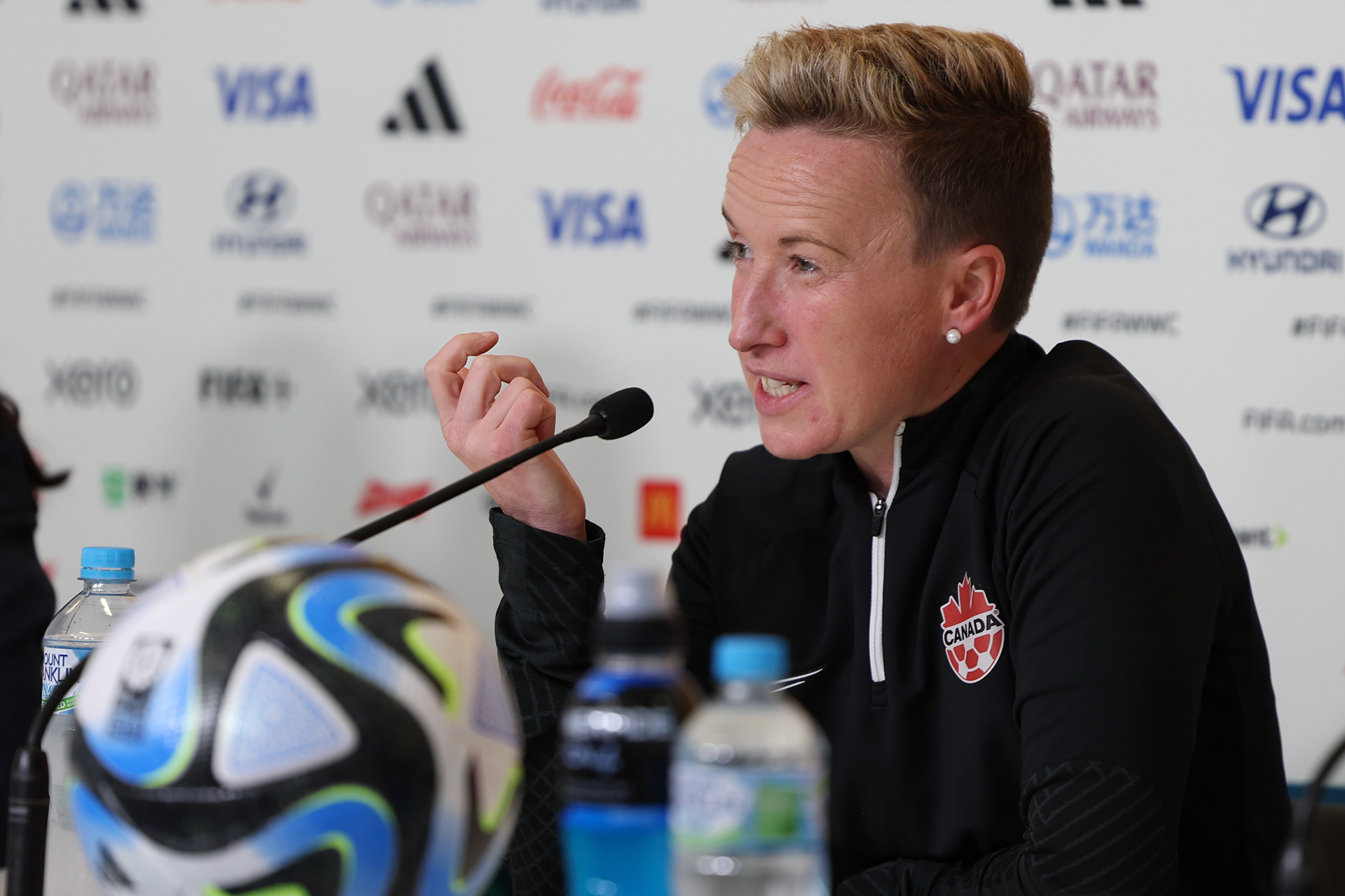 Canada's head coach Bev Priestman gestures during a news conference ahead of a match against Australia for the Women's World Cup in Melbourne, Australia, Sunday, July 30, 2023. The last time Canada played a high-stakes international match, for the 2020 Olympic gold medal, it was in an eerily empty stadium. On Monday night, July 31, 2023, in a pivotal Women's World Cup match against tournament co-host Australia, Canada is expecting a very different environment –- a stadium full of the opposing team's fans. (AP Photo/Victoria Adkins)