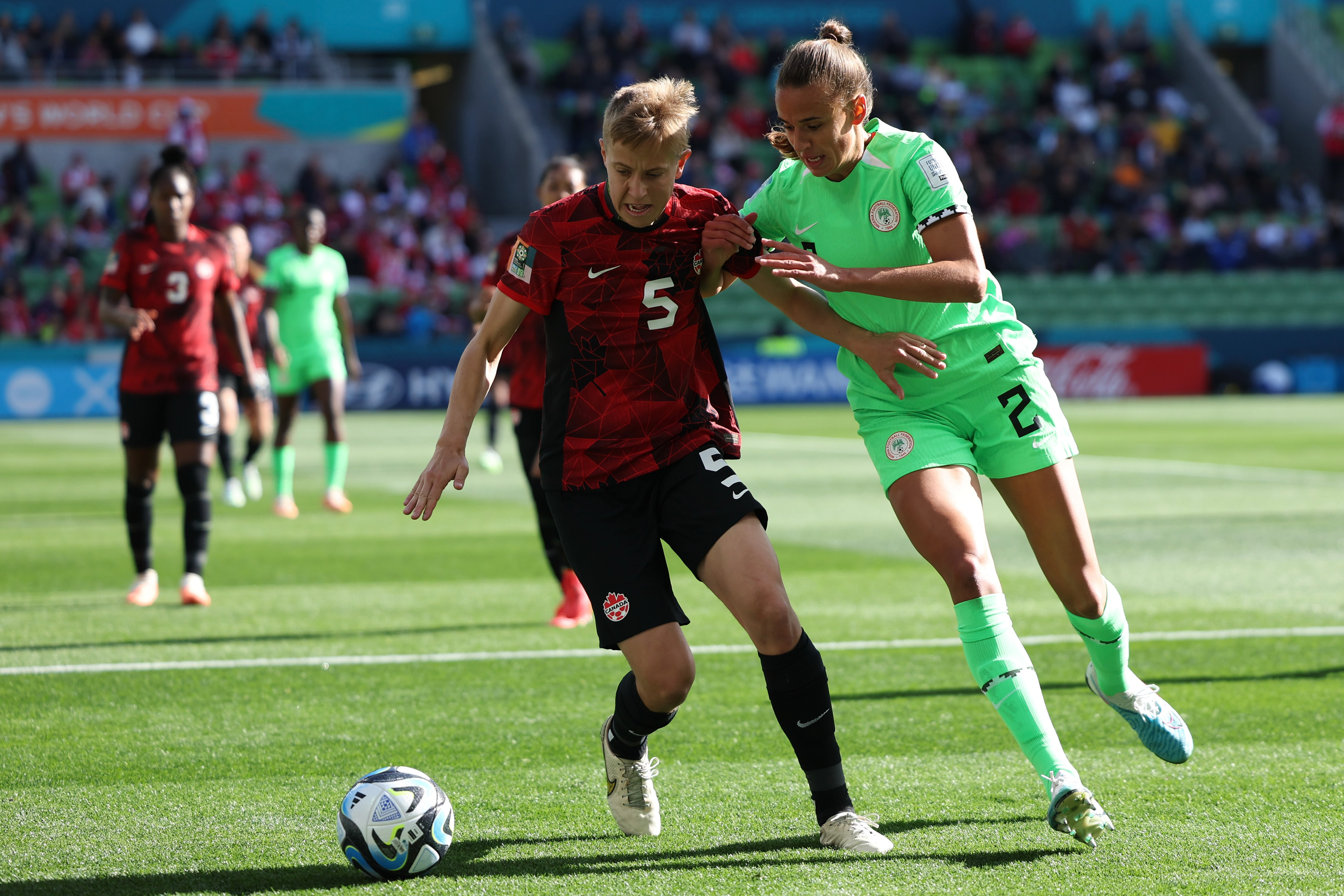 Canada's Quinn and Nigeria's Ashleigh Plumptre battle for the ball during the Women's World Cup Group B soccer match between Nigeria and Canada in Melbourne, Australia, Friday, July 21, 2023. (AP Photo/Victoria Adkins)