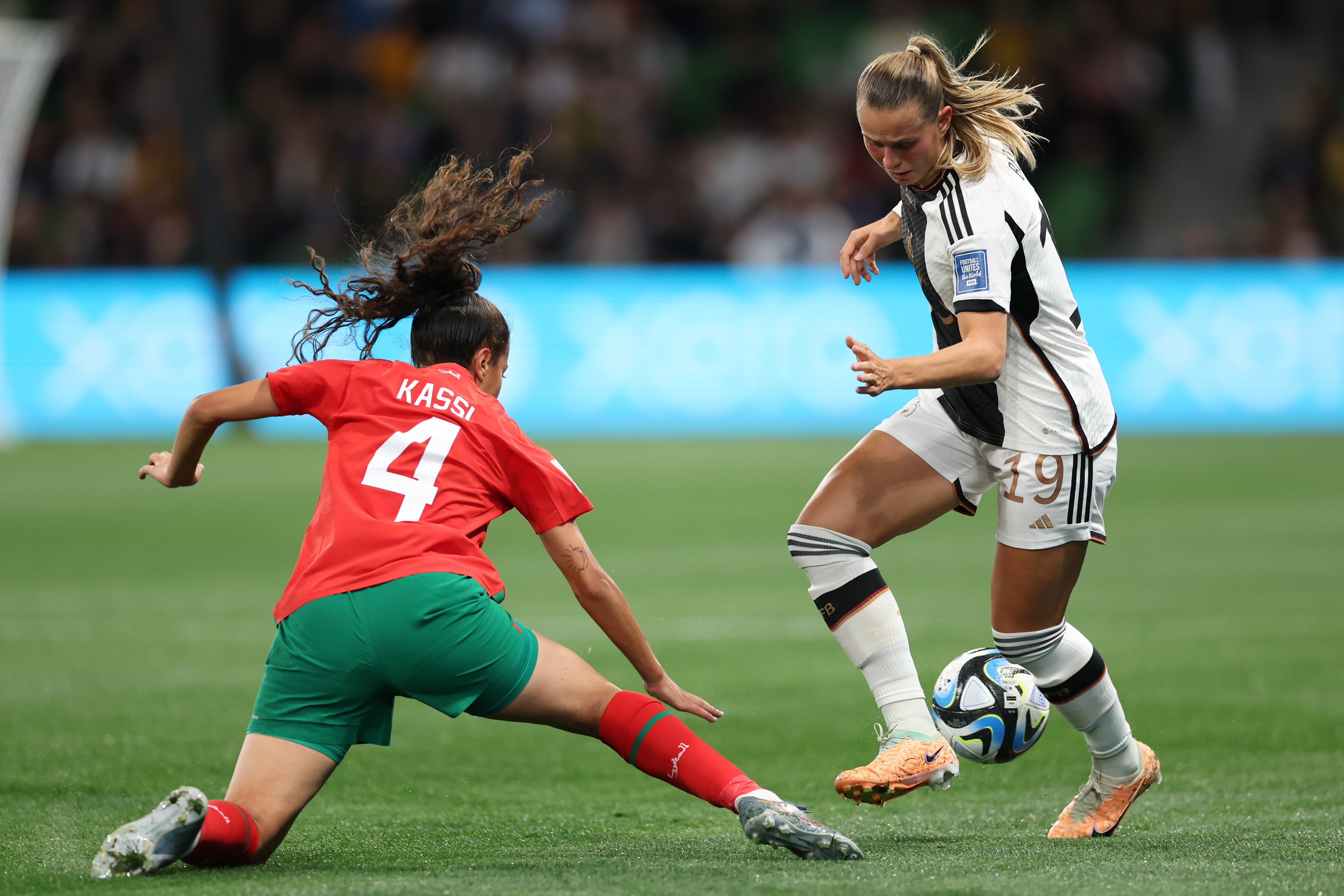 Morocco's Sarah Kassi, left, vies for the ball with Germany's Klara Buehl during the Women's World Cup Group H soccer match between Germany and Morocco in Melbourne, Australia, Monday, July 24, 2023. (AP Photo/Victoria Adkins)