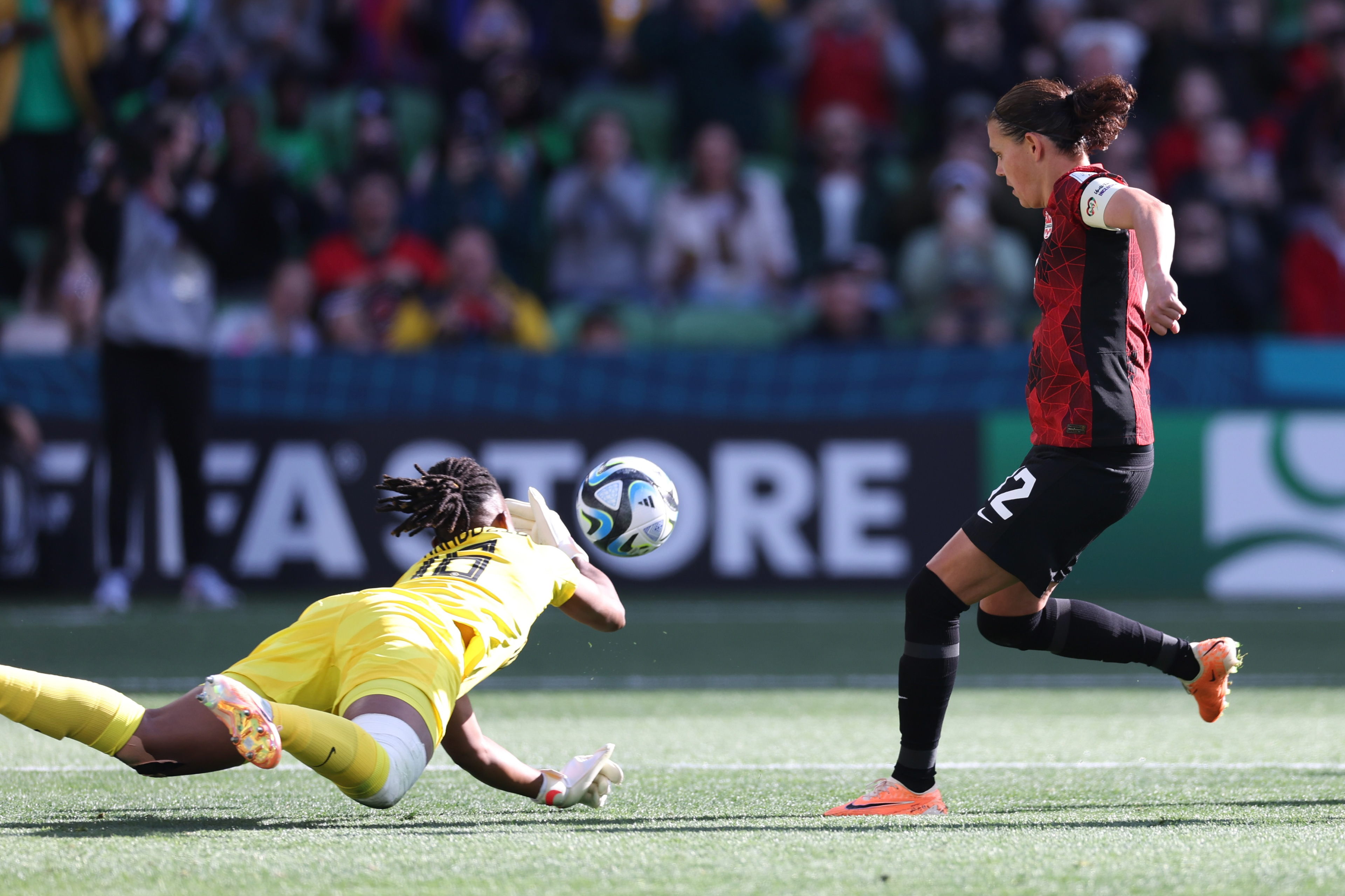 Nigeria's goalkeeper Chiamaka Nnadozie saves a penalty kick by Canada's Christine Sinclair, right, during the Women's World Cup Group B soccer match between Nigeria and Canada in Melbourne, Australia, Friday, July 21, 2023. (AP Photo/Victoria Adkins)