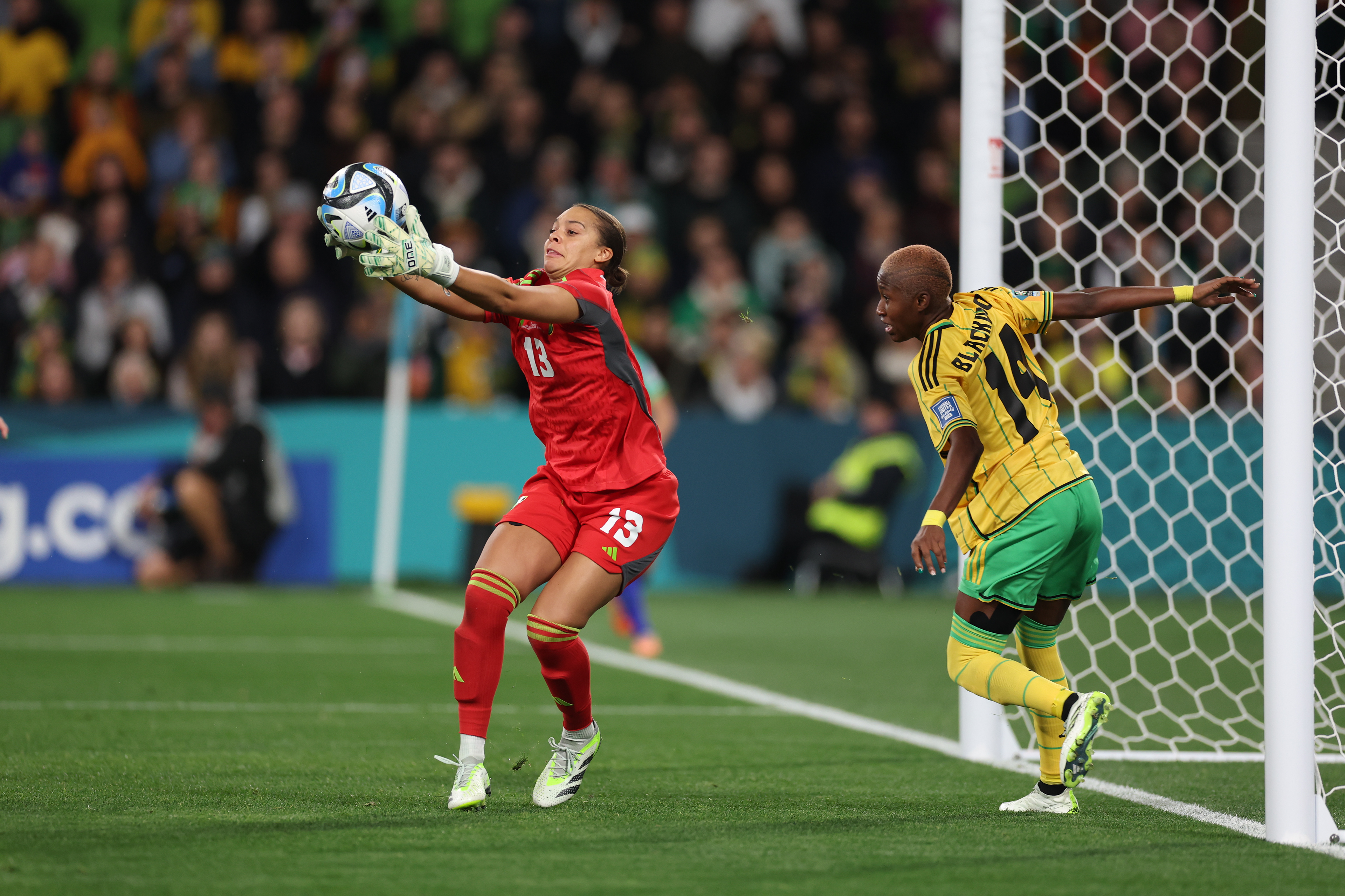 Jamaica's goalkeeper Rebecca Spencer pulls in a ball in front of teammate Jamaica's Deneisha Blackwood during the Women's World Cup Group F soccer match between Jamaica and Brazil in Melbourne, Australia, Wednesday, Aug. 2, 2023. (AP Photo/Victoria Adkins)