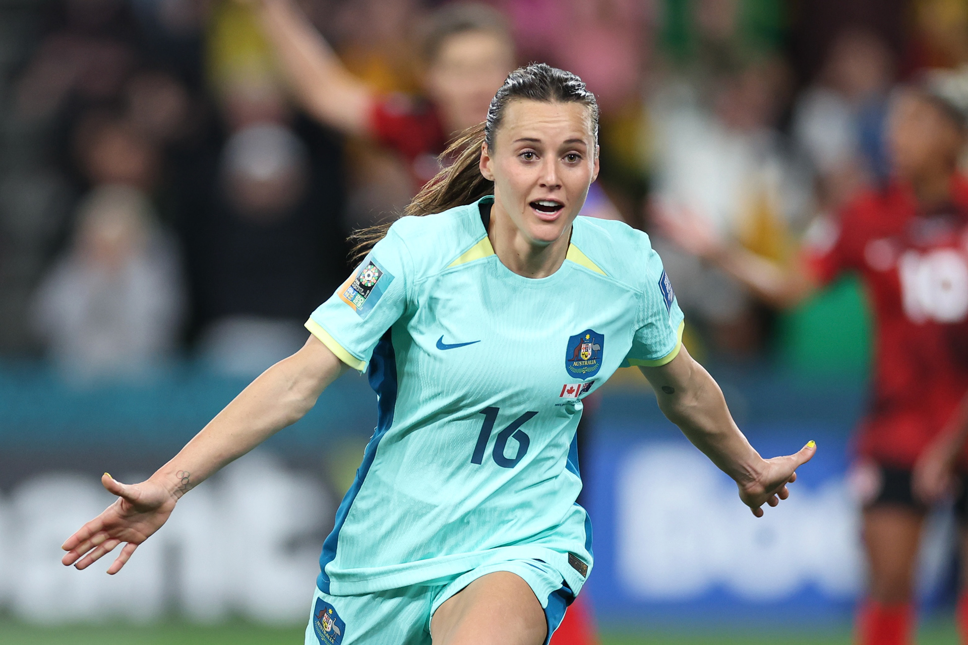 Australia's Hayley Raso celebrates after scoring her side's second goal during the Women's World Cup Group B soccer match between Australia and Canada in Melbourne, Australia, Monday, July 31, 2023. (AP Photo/Victoria Adkins)