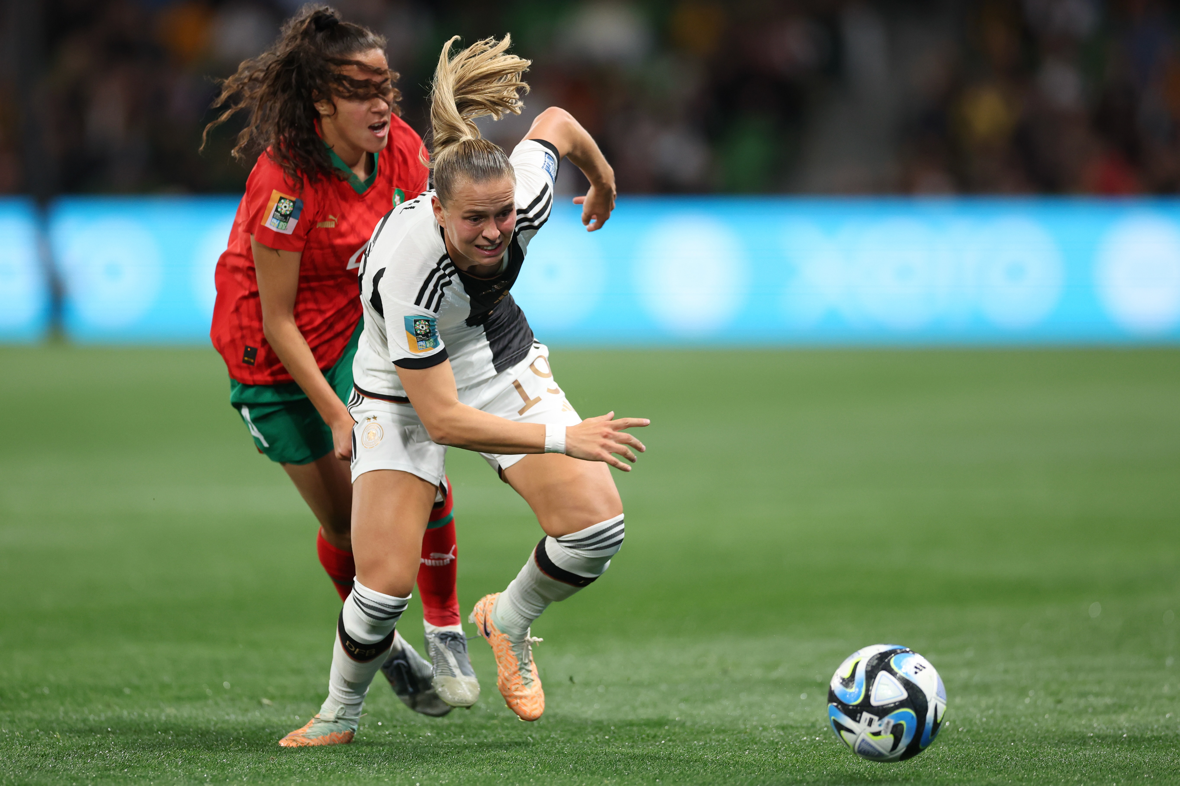Germany's Klara Buehl leaves behind Morocco's Sarah Kassi, left, during the Women's World Cup Group H soccer match between Germany and Morocco in Melbourne, Australia, Monday, July 24, 2023. (AP Photo/Victoria Adkins)