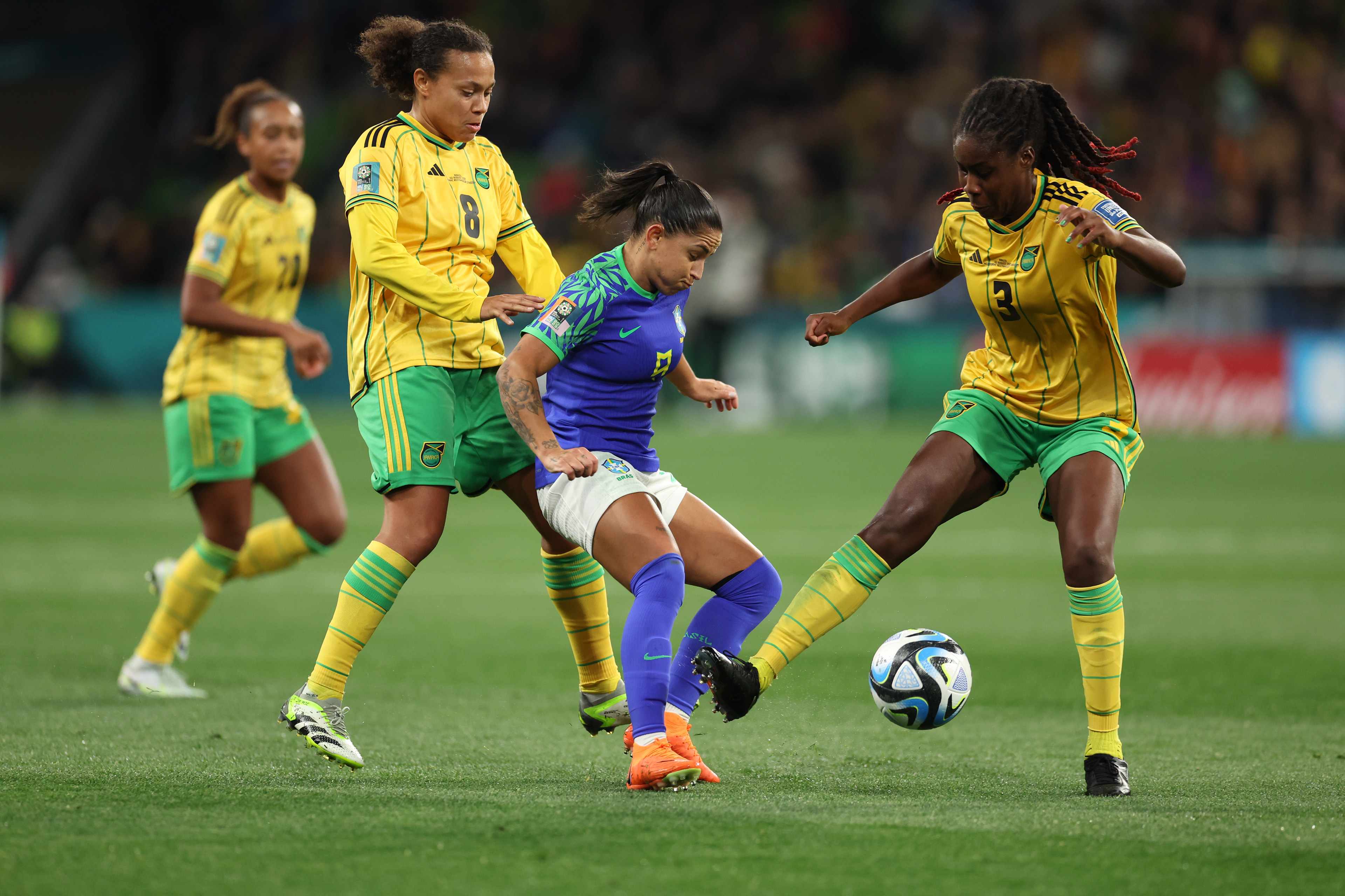 Brazil's Debinha, center, in action against Jamaica's Drew Spence, left, and Jamaica's Vyan Sampson during the Women's World Cup Group F soccer match between Jamaica and Brazil in Melbourne, Australia, Wednesday, Aug. 2, 2023. (AP Photo/Victoria Adkins)