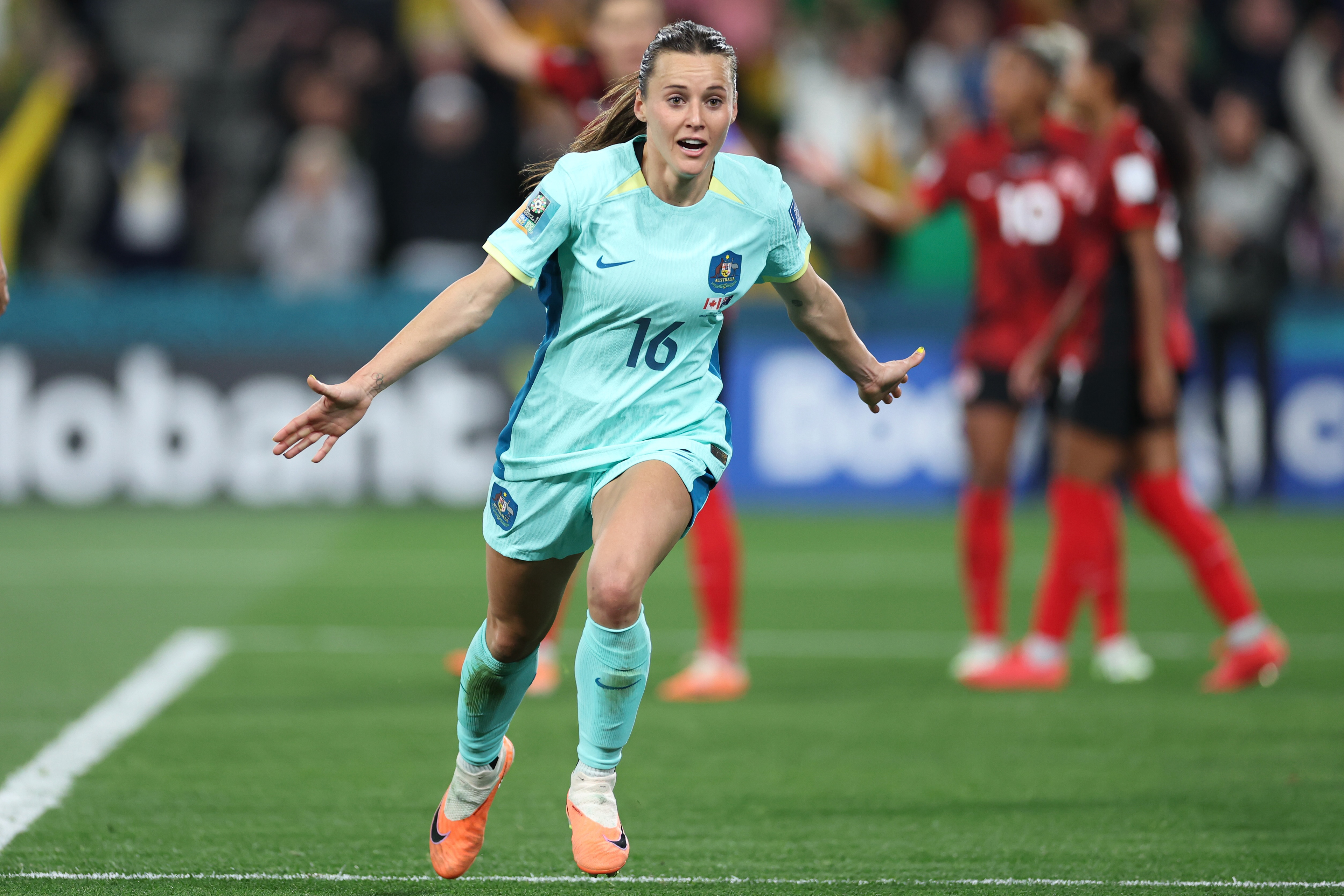 Australia's Hayley Raso celebrates after scoring her side's second goal during the Women's World Cup Group B soccer match between Australia and Canada in Melbourne, Australia, Monday, July 31, 2023. (AP Photo/Victoria Adkins)