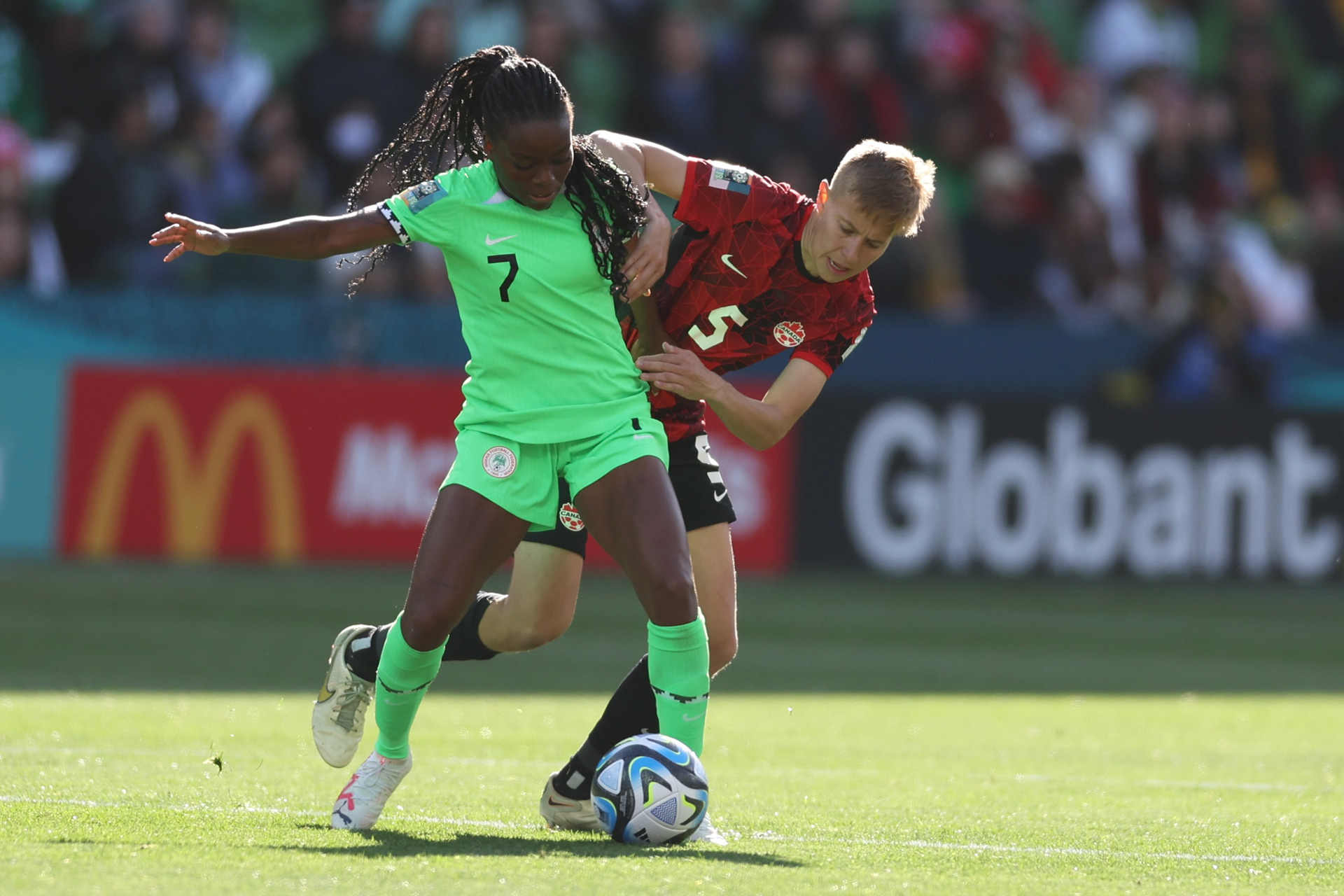 Nigeria's Antionette Payne, left, competes with Canada's Quinn during the Women's World Cup Group B soccer match between Nigeria and Canada in Melbourne, Australia, Friday, July 21, 2023. (AP Photo/Victoria Adkins)