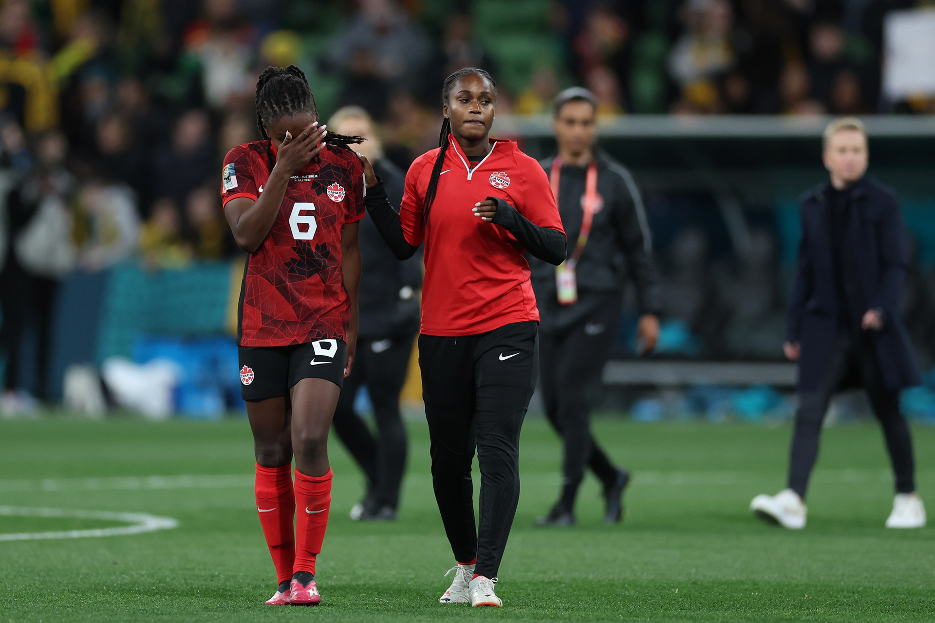 Canada's Deanne Rose, left, leaves the field a the end of the Women's World Cup Group B soccer match between Australia and Canada in Melbourne, Australia, Monday, July 31, 2023. Australia won 4-0. (AP Photo/Victoria Adkins)
