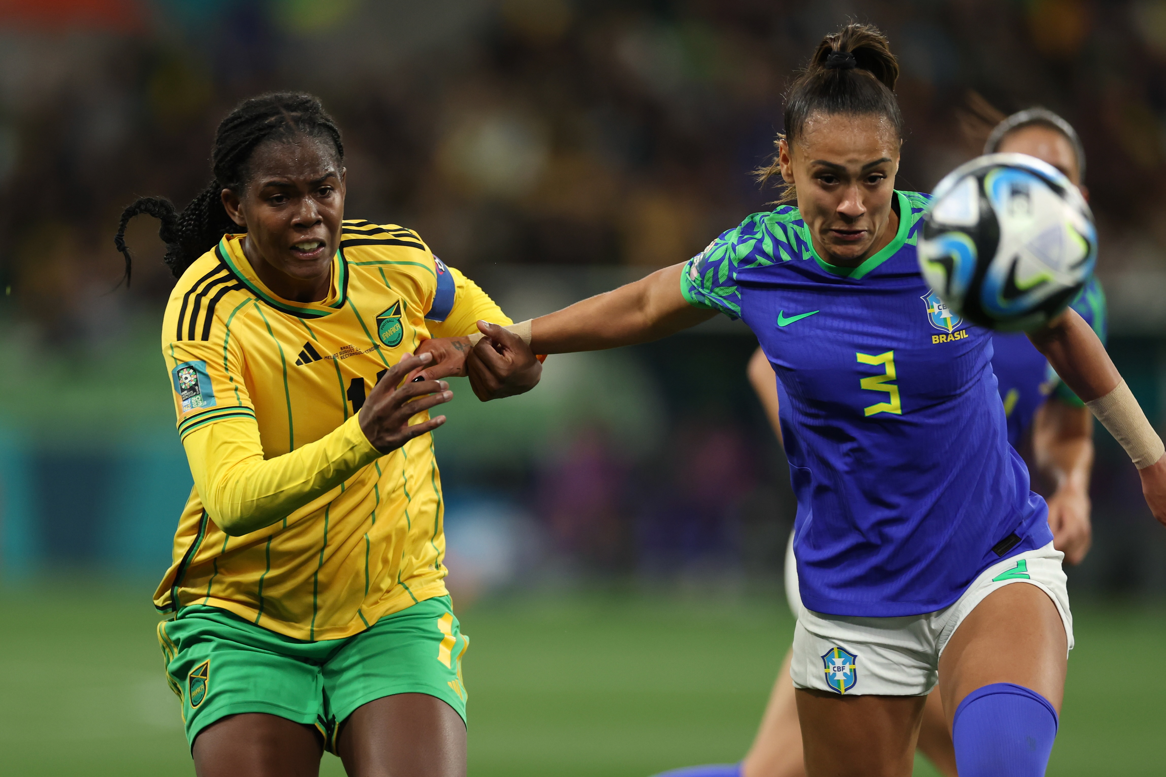 Jamaica's Khadija Shaw, left, in action against Brazil's Kathellen during the Women's World Cup Group F soccer match between Jamaica and Brazil in Melbourne, Australia, Wednesday, Aug. 2, 2023. (AP Photo/Victoria Adkins)