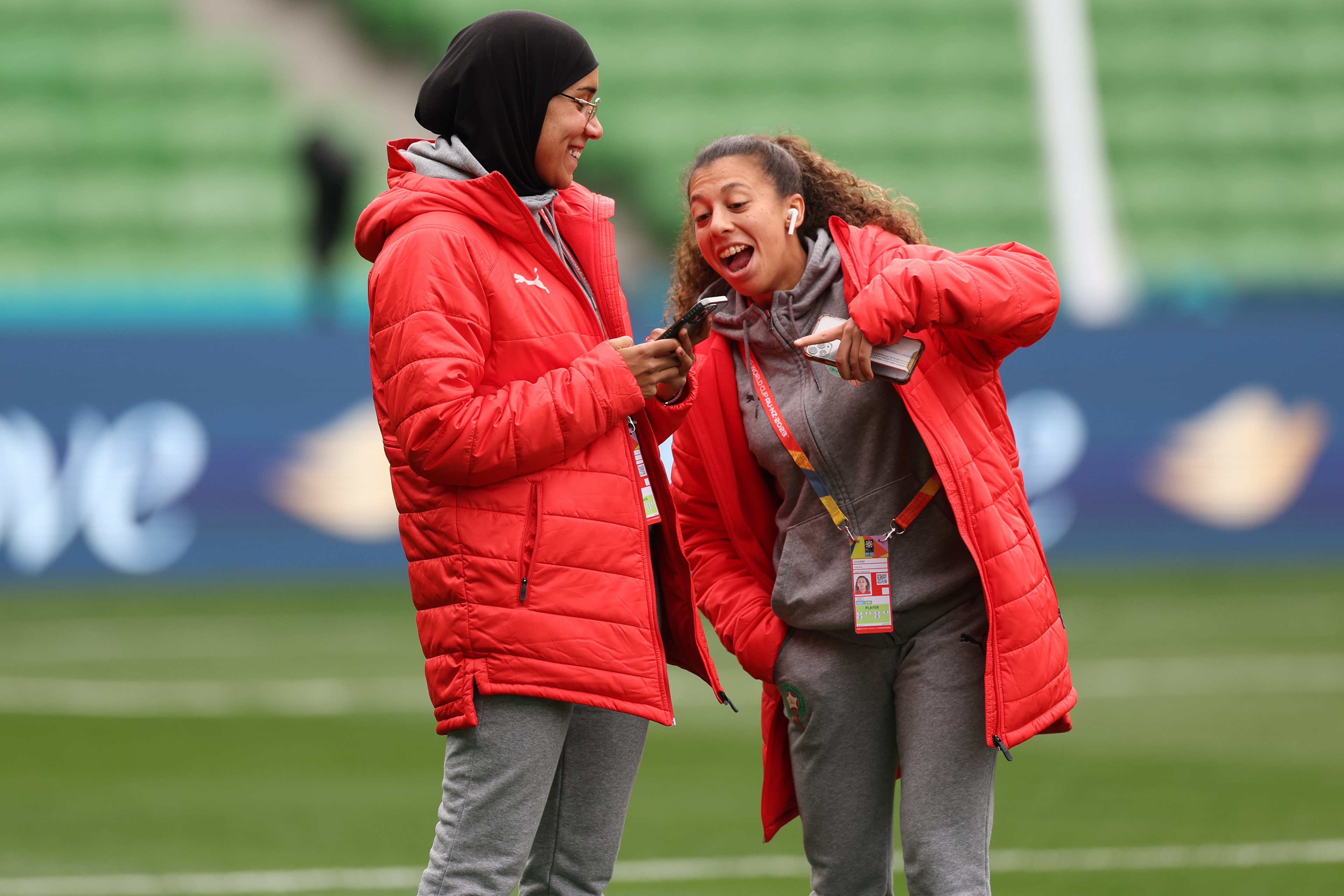 Morocco's Nouhaila Benzina, left, and Fatima Gharbi walk around the ground during a familiarization tour ahead of their Women's World Cup Group H match against Germany in Melbourne, Australia, Sunday, July 23, 2023. When Benzina steps onto the pitch Monday evening, she will be first player to compete in a senior-level FIFA Women's World Cup wearing a hijab. (AP Photo/Victoria Adkins)