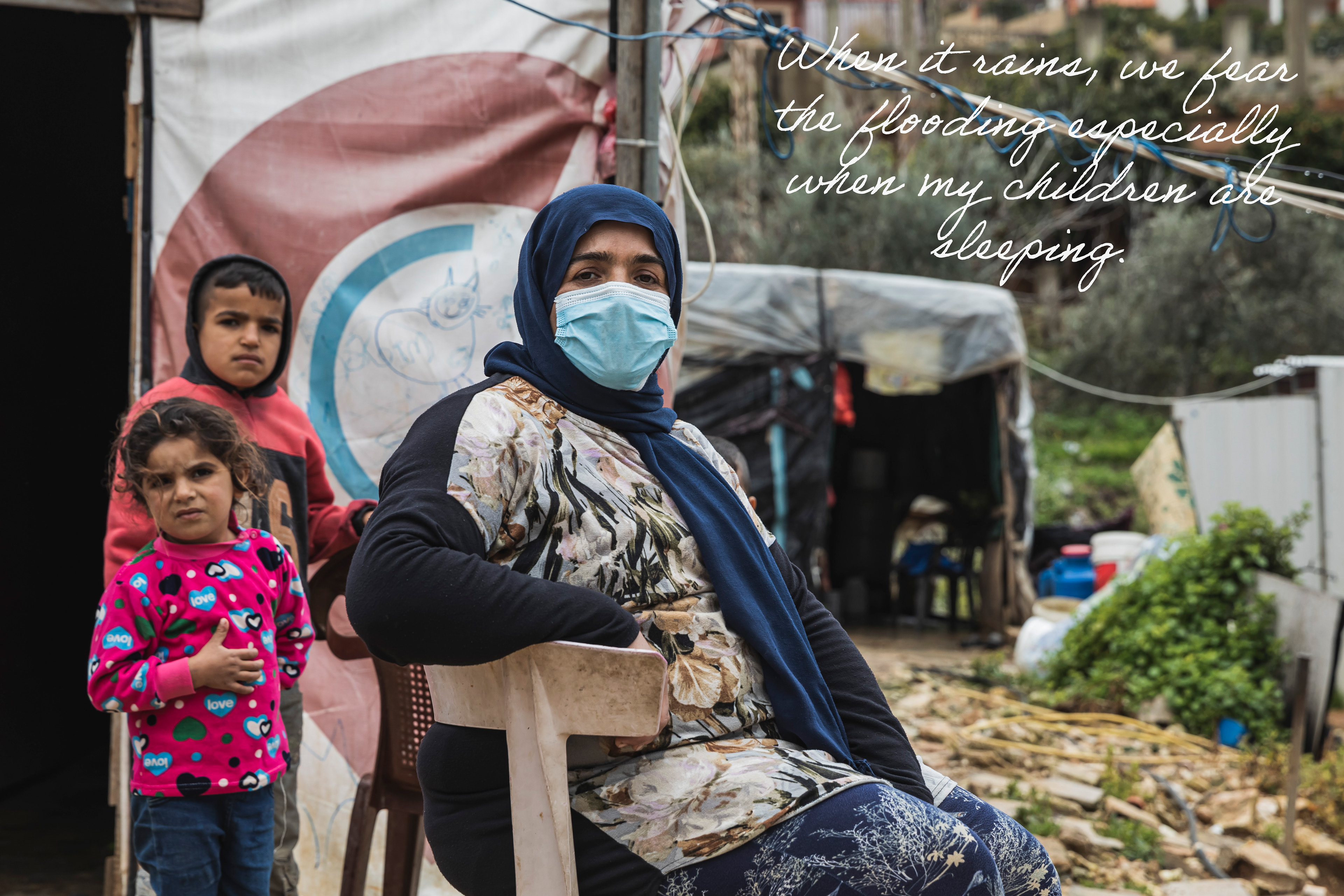 Esra, Lebanese woman with her children outside her tent in South Lebanon.