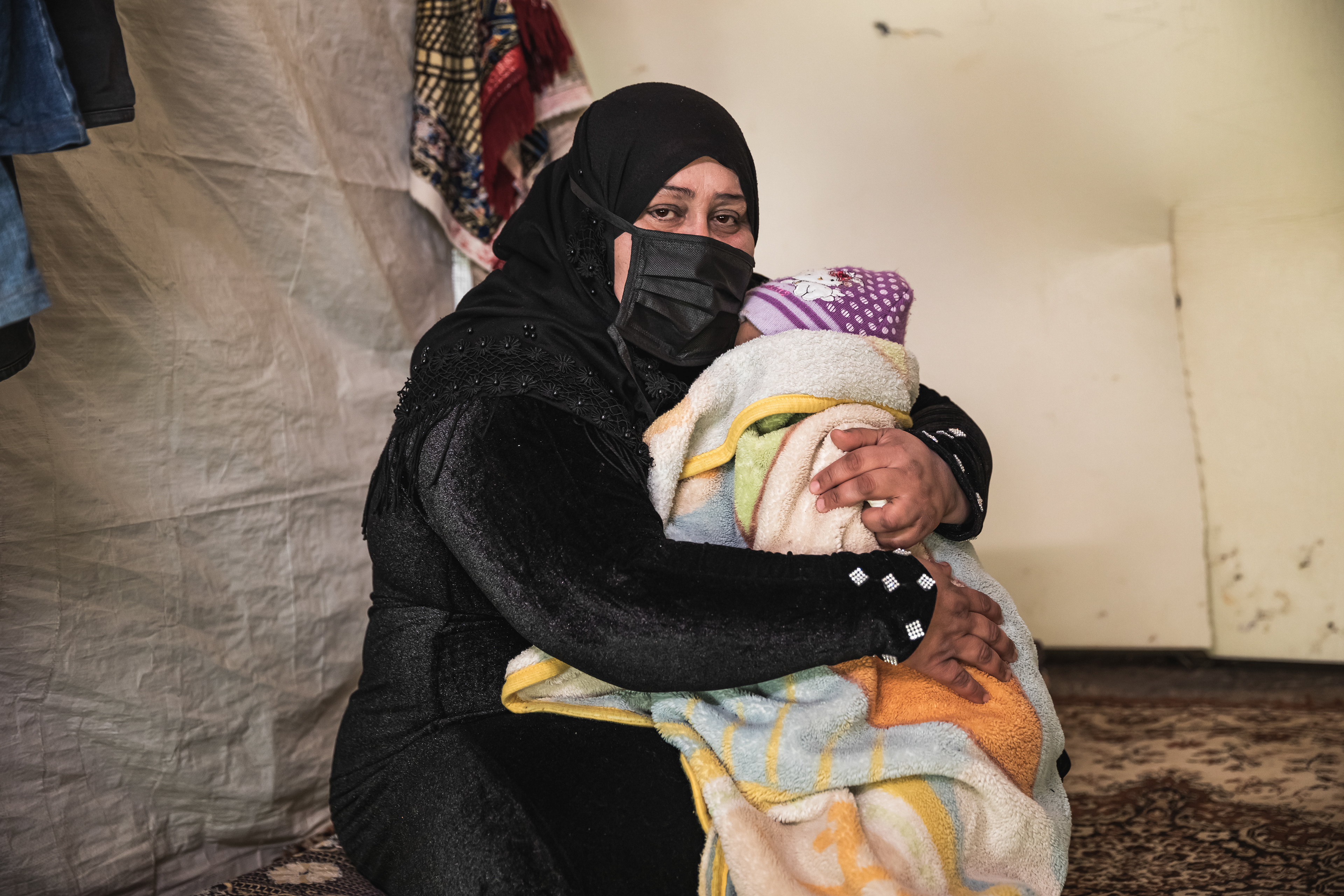 Lama, Syrian refugee living in South Lebanon, with her baby girl.
